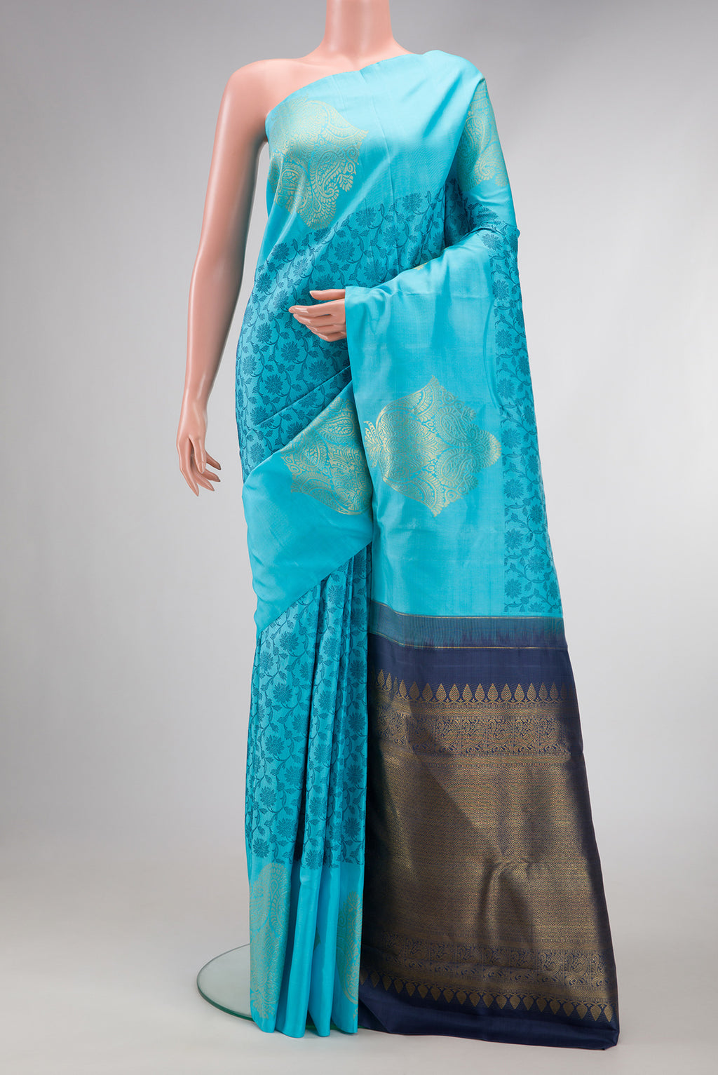 Sky Blue Dual Tone Kanjivaram Silk Saree with Zari Butta on the body and Fancy Border.  displayed on a mannequin