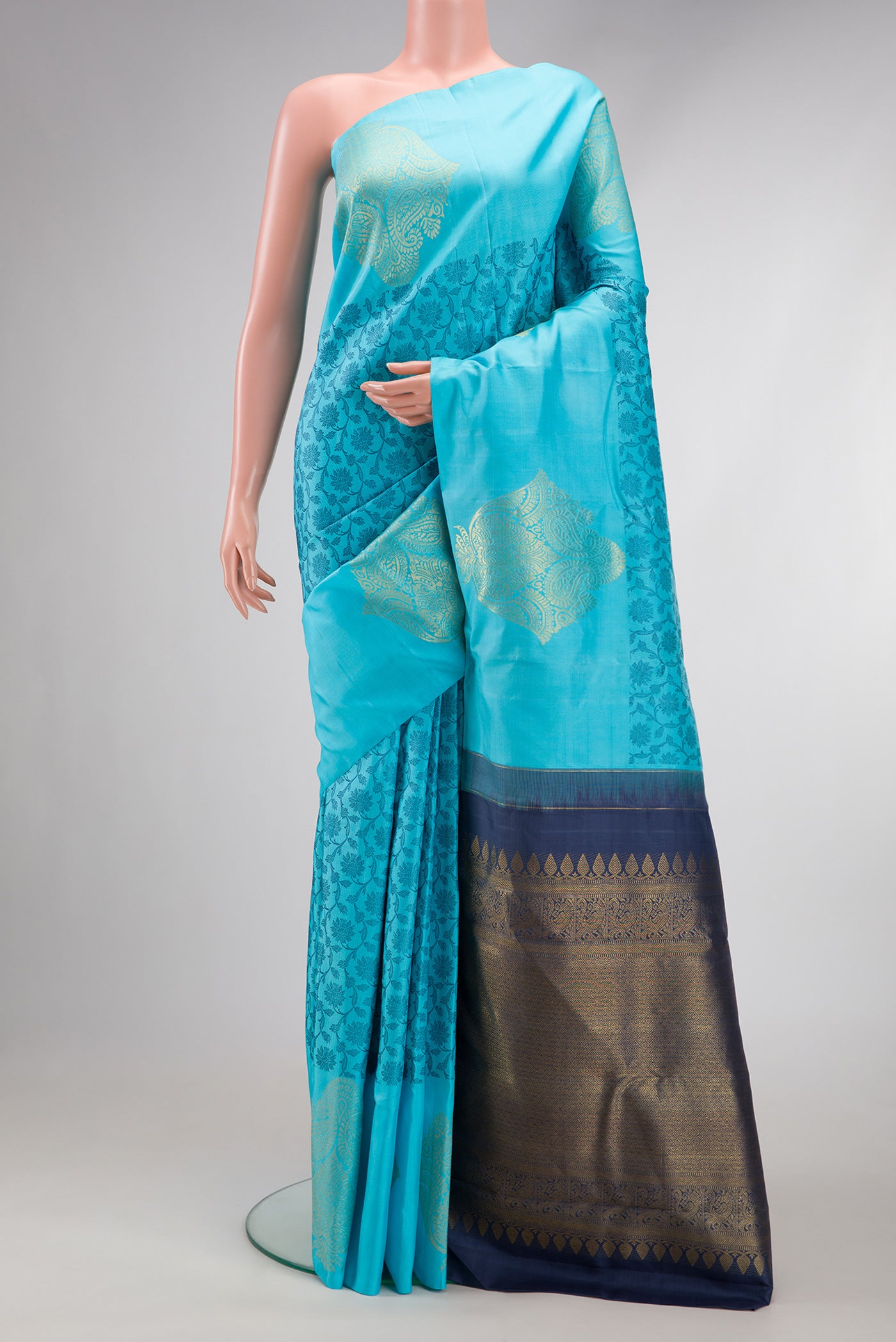 Sky Blue Dual Tone Kanjivaram Silk Saree with Zari Butta on the body and Fancy Border.  displayed on a mannequin