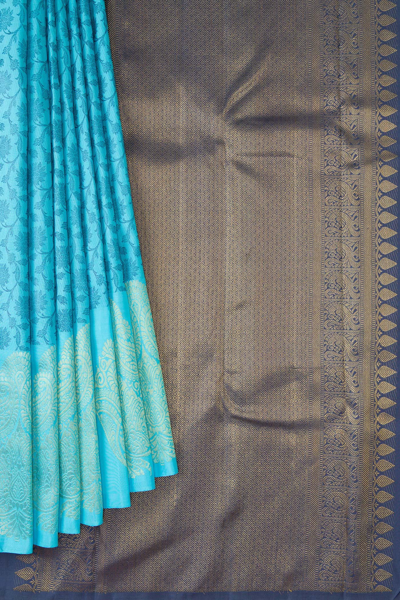 Pleats and pallu of Sky Blue Dual Tone Kanjivaram Silk Saree with Zari Butta on the body and Fancy Border. 