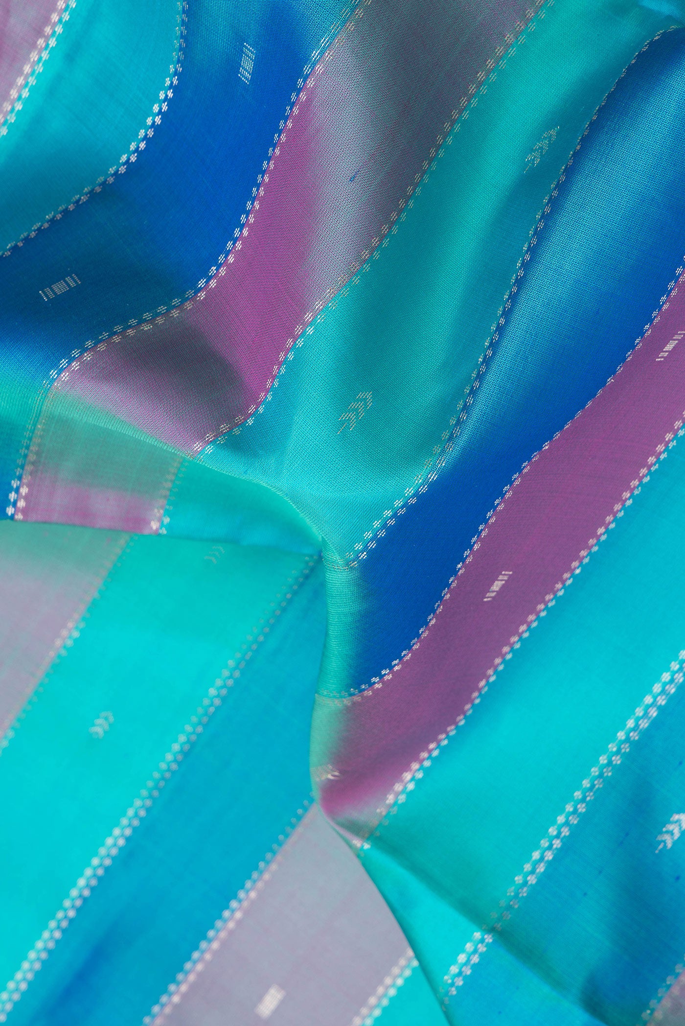 Close up of Multi Color Soft Silk Saree with Stripes on the body and Without Border.  displaying folds