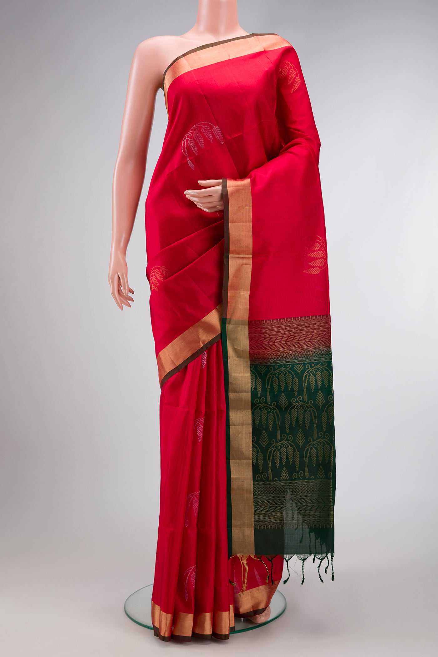 Red Dual Tone Soft Silk Saree with Zari Butta on the body and Zari Border.  displayed on a mannequin