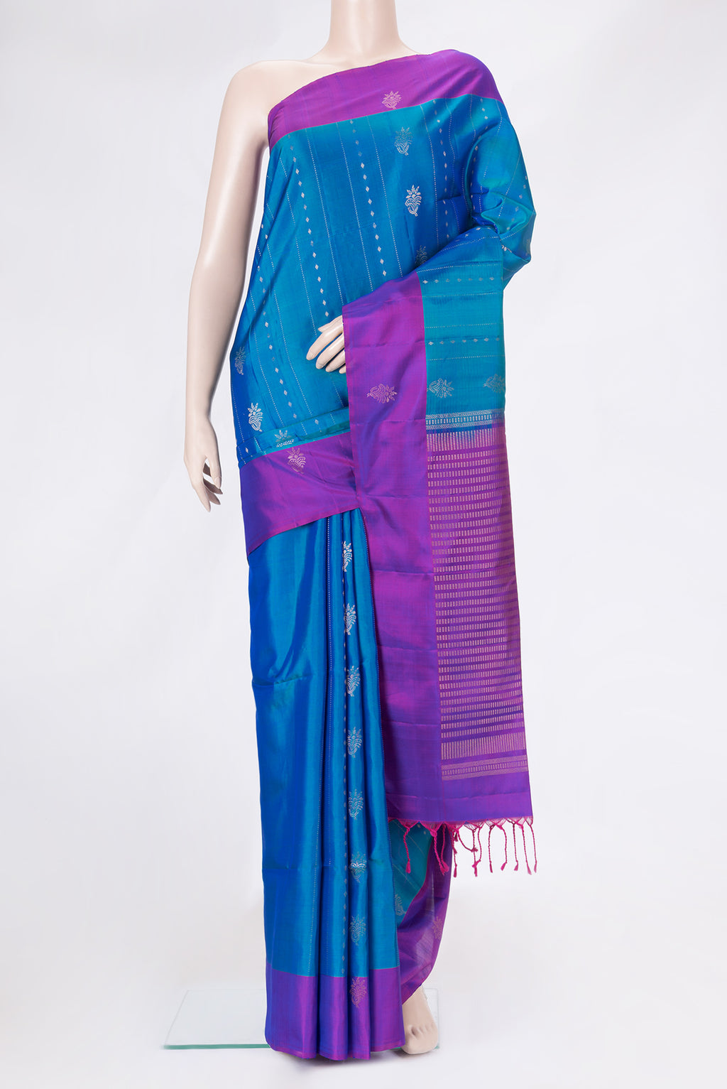 Peacock Blue Dual Tone Soft Silk Saree with Stripes on the body and Fancy Border.  displayed on a mannequin