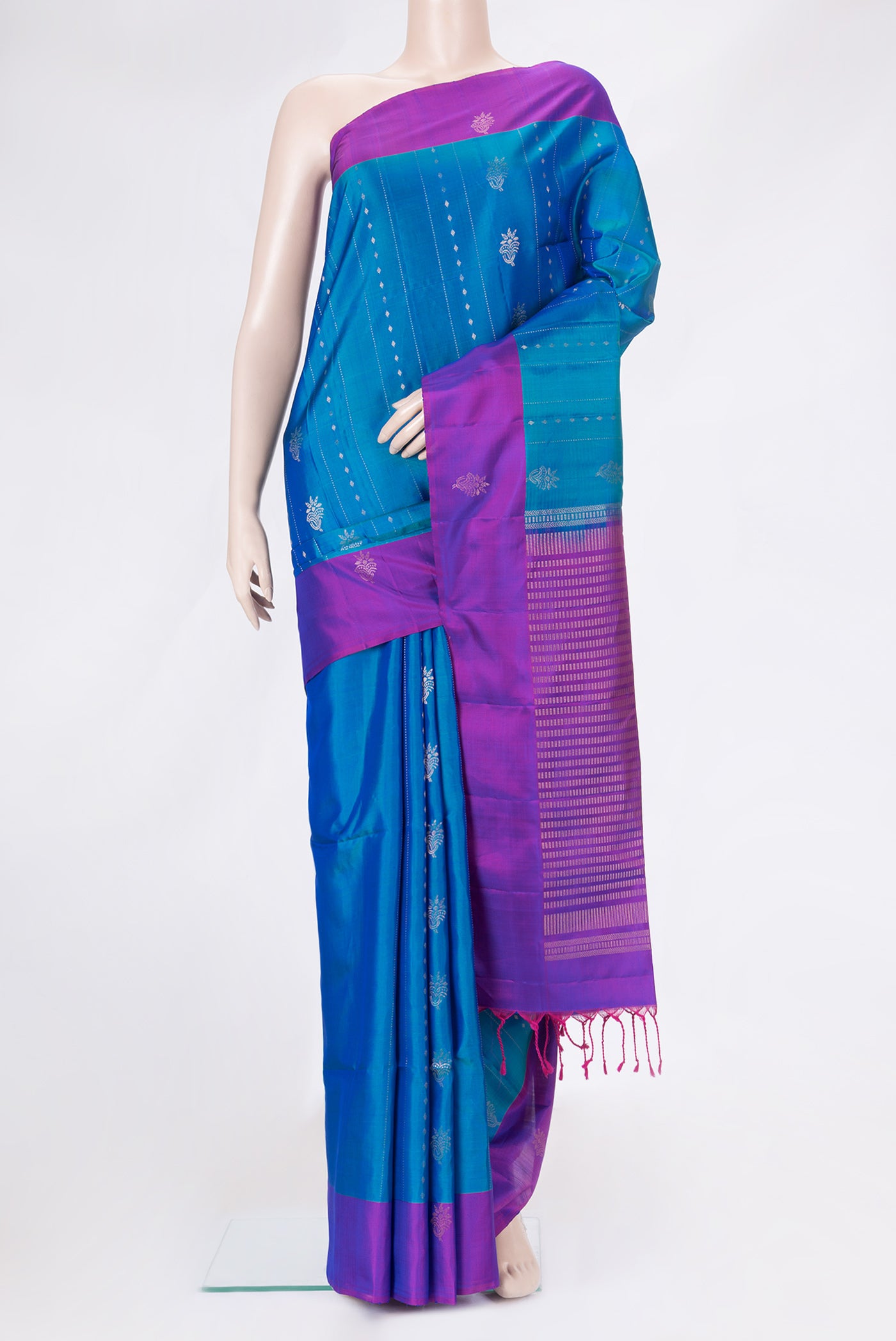 Peacock Blue Dual Tone Soft Silk Saree with Stripes on the body and Fancy Border.  displayed on a mannequin