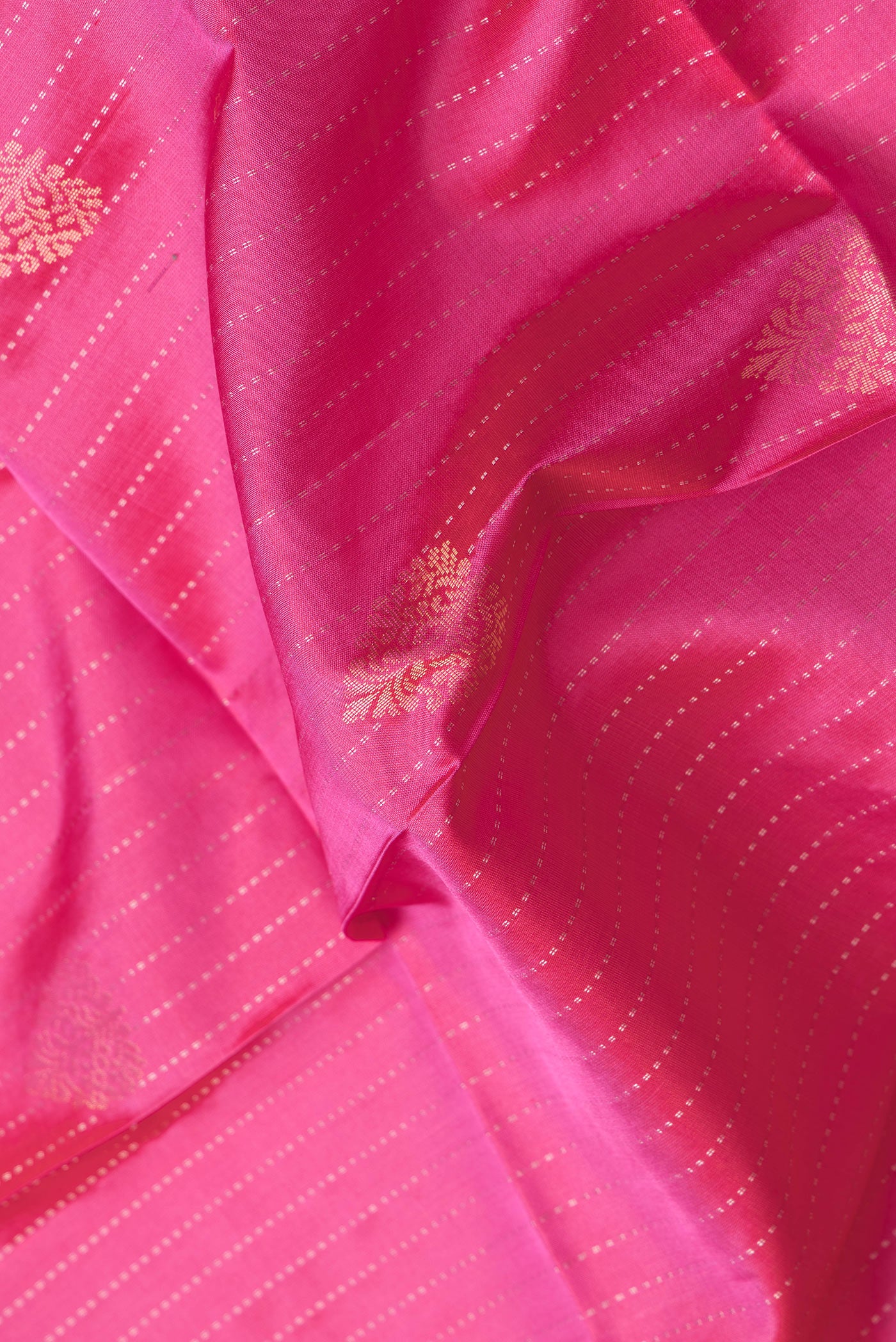 Close up of Pink Dual Tone Soft Silk Saree with Stripes on the body and Without Border.  displaying folds