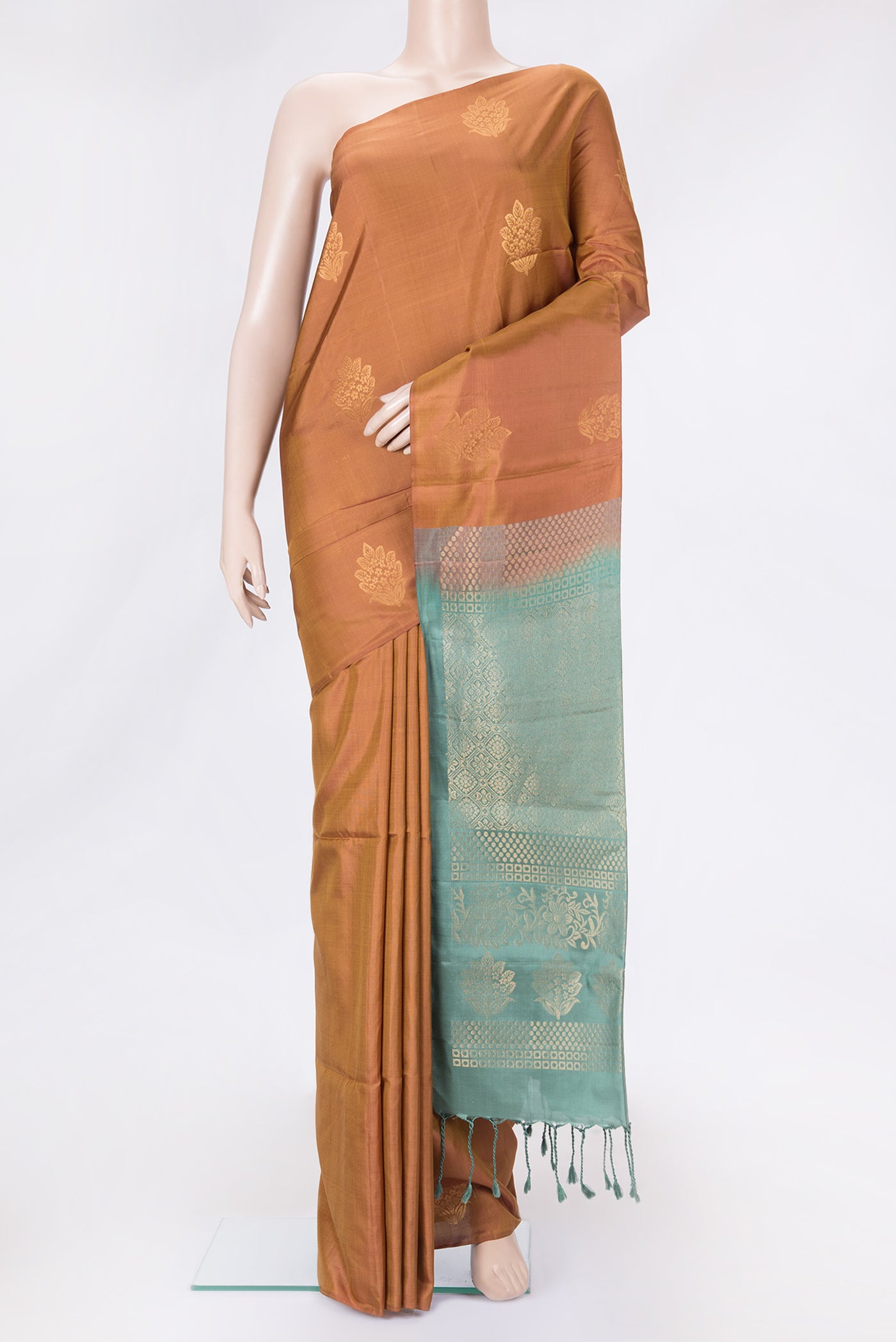 Gold Dual Tone Soft Silk Saree with Zari Butta on the body and Without Border.  displayed on a mannequin