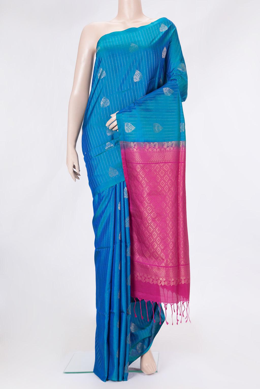 Peacock Blue Dual Tone Soft Silk Saree with Stripes on the body and Without Border.  displayed on a mannequin