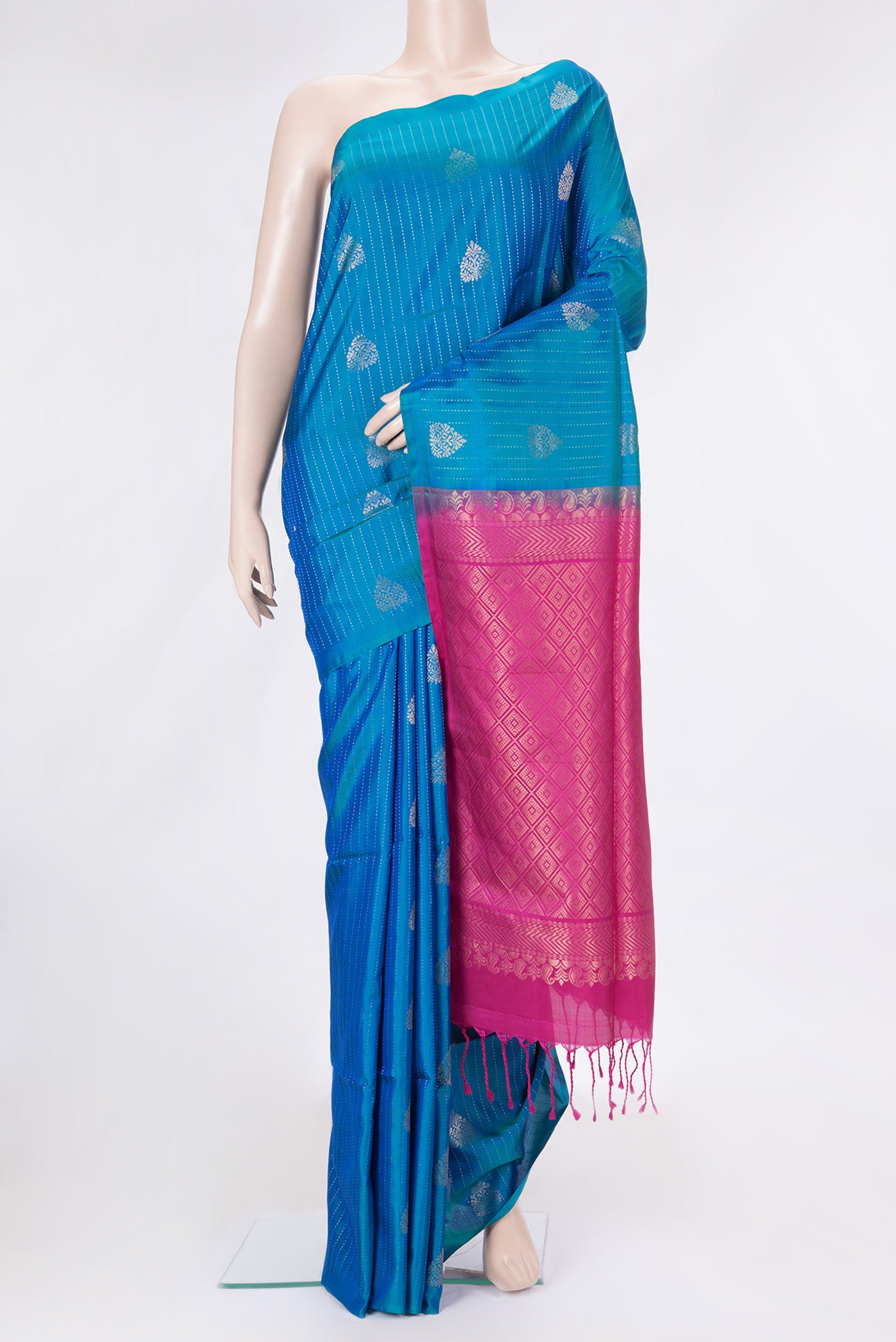 Peacock Blue Dual Tone Soft Silk Saree with Stripes on the body and Without Border.  displayed on a mannequin