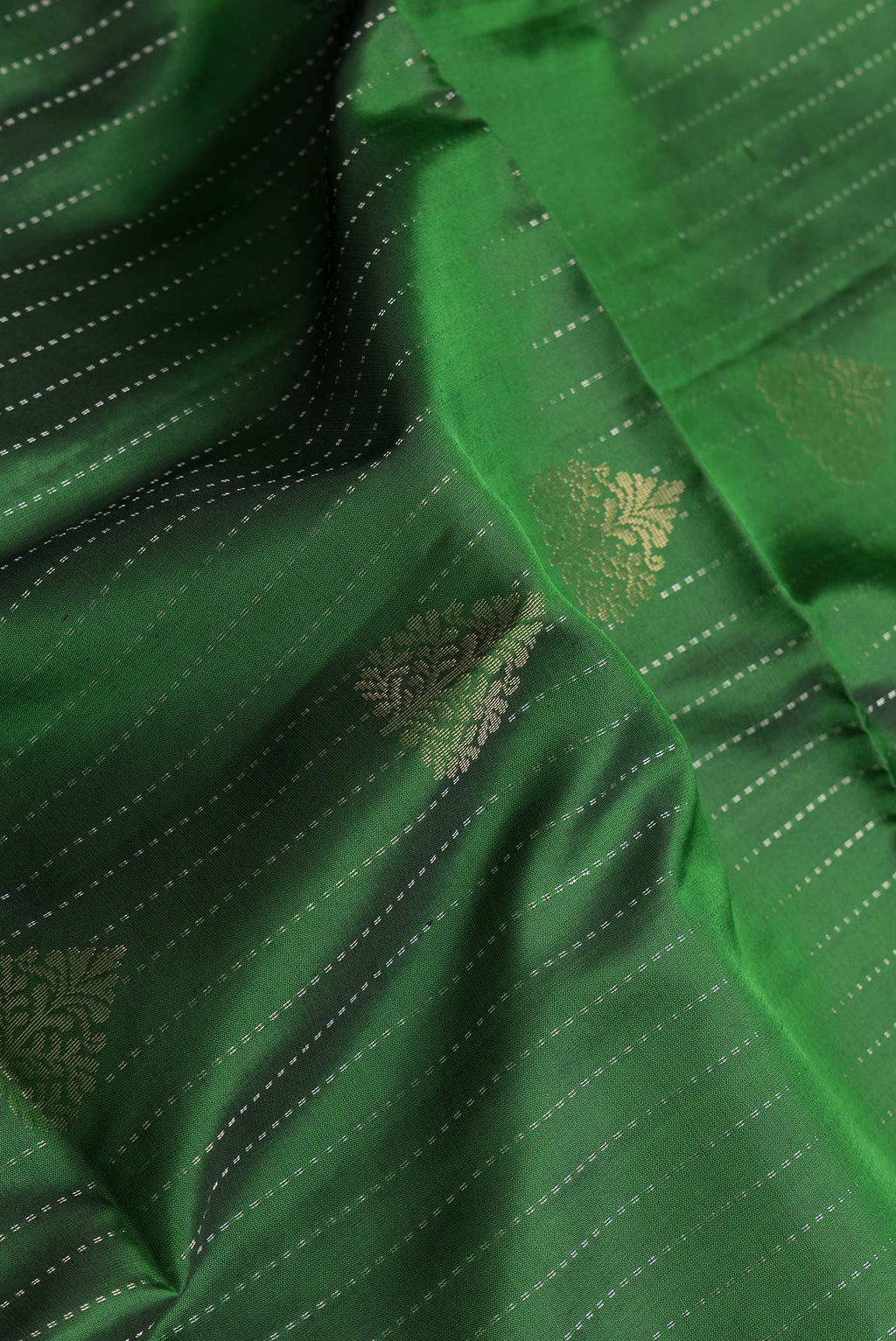 Close up of Bottle Green Dual Tone Soft Silk Saree with Stripes on the body and Without Border.  displaying folds