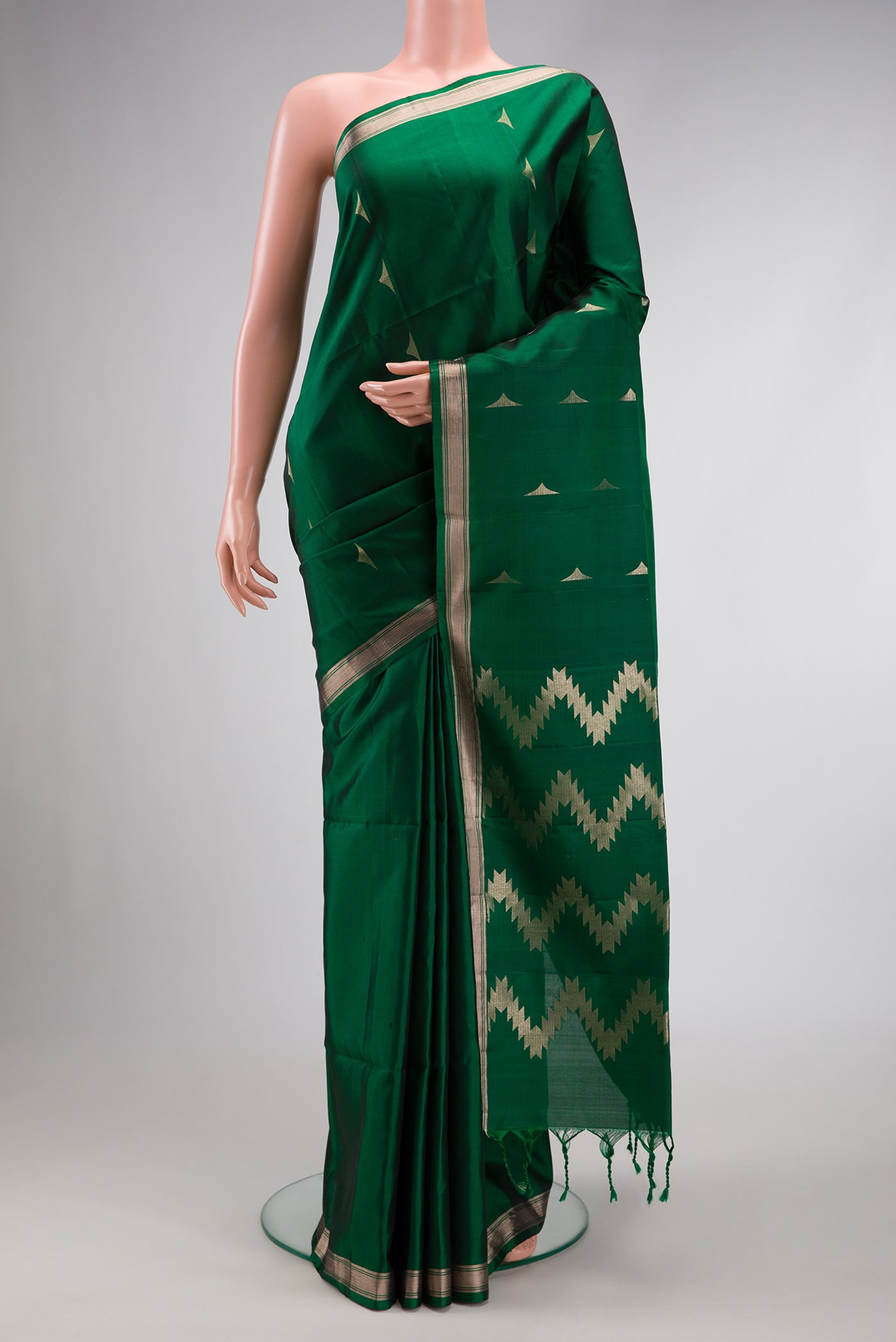 Green Dual Tone Soft Silk Saree with Zari Butta on the body and Zari Border.  displayed on a mannequin