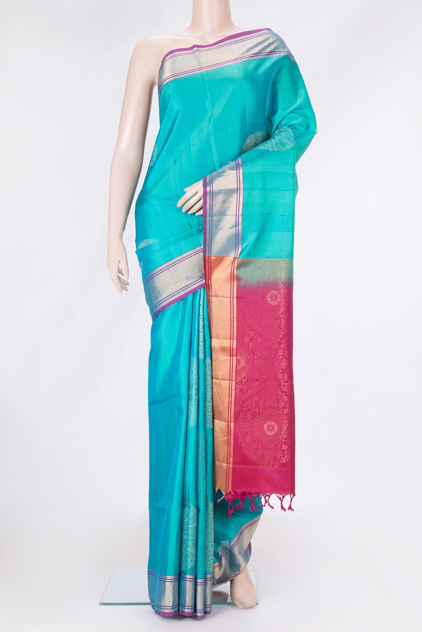 Sky Blue Dual Tone Soft Silk Saree with Zari Butta on the body and Zari Border.  displayed on a mannequin