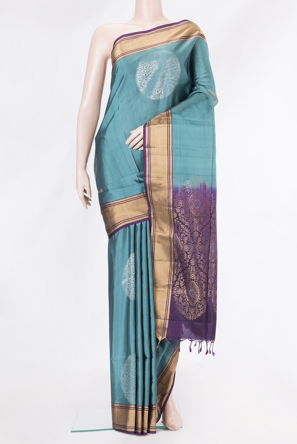 Blue Grey Soft Silk Saree with Zari Butta on the body and Zari Border.  displayed on a mannequin