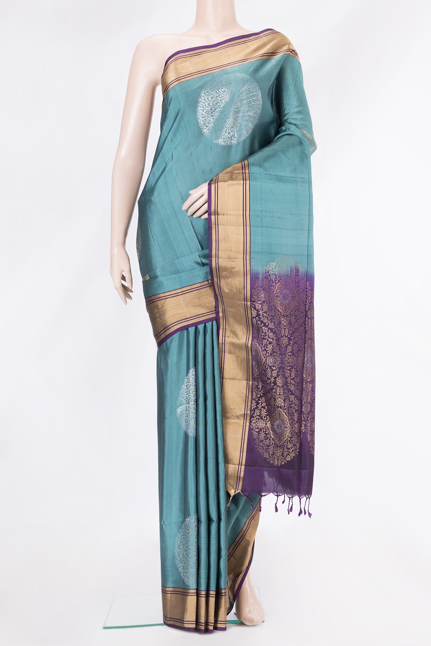 Blue Grey Soft Silk Saree with Zari Butta on the body and Zari Border.  displayed on a mannequin