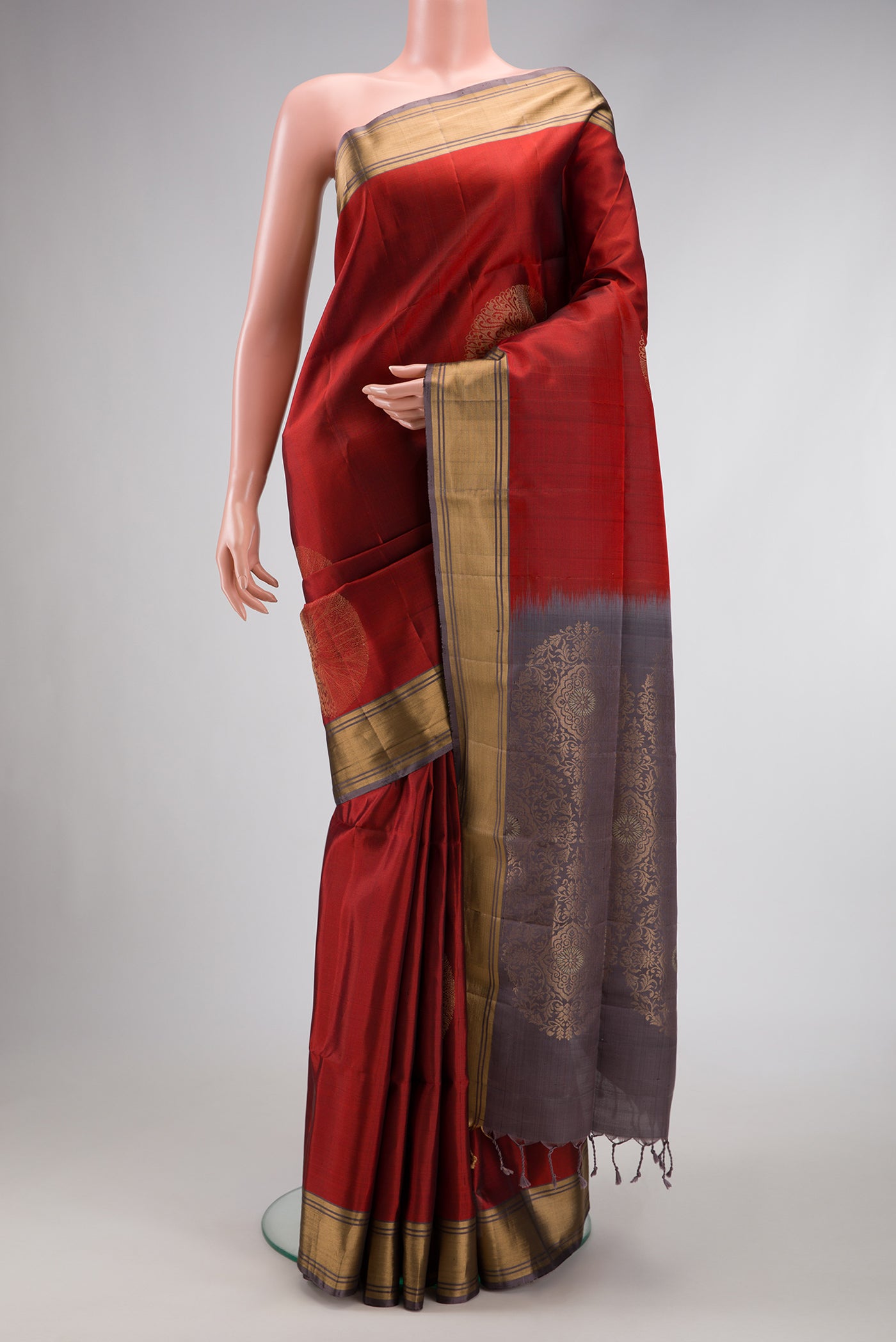 Maroon Dual Tone Soft Silk Saree with Zari Butta on the body and Zari Border.  displayed on a mannequin