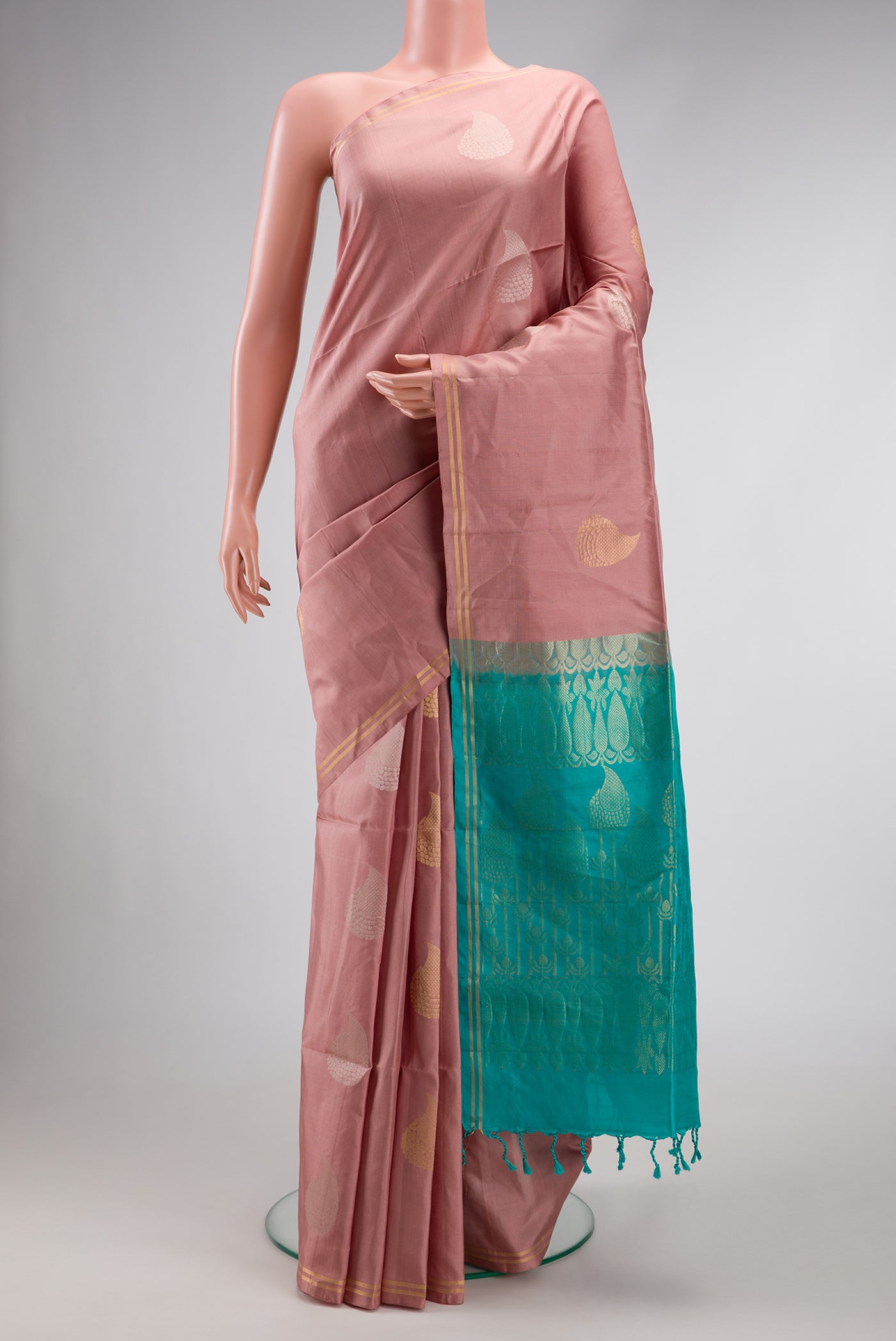 Rose Gold Dual Tone Soft Silk Saree with Zari Butta on the body and Zari Border.  displayed on a mannequin