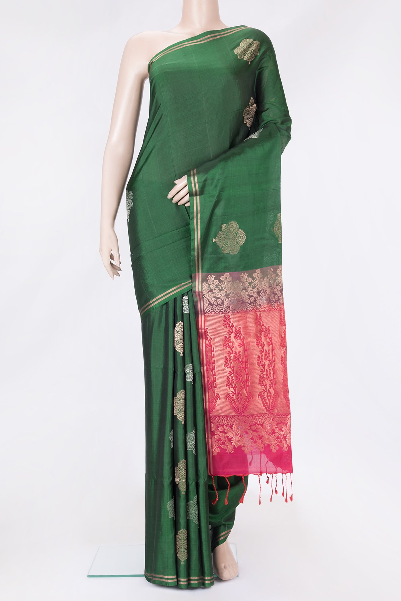 Bottle Green Dual Tone Soft Silk Saree with Zari Butta on the body and Zari Border.  displayed on a mannequin