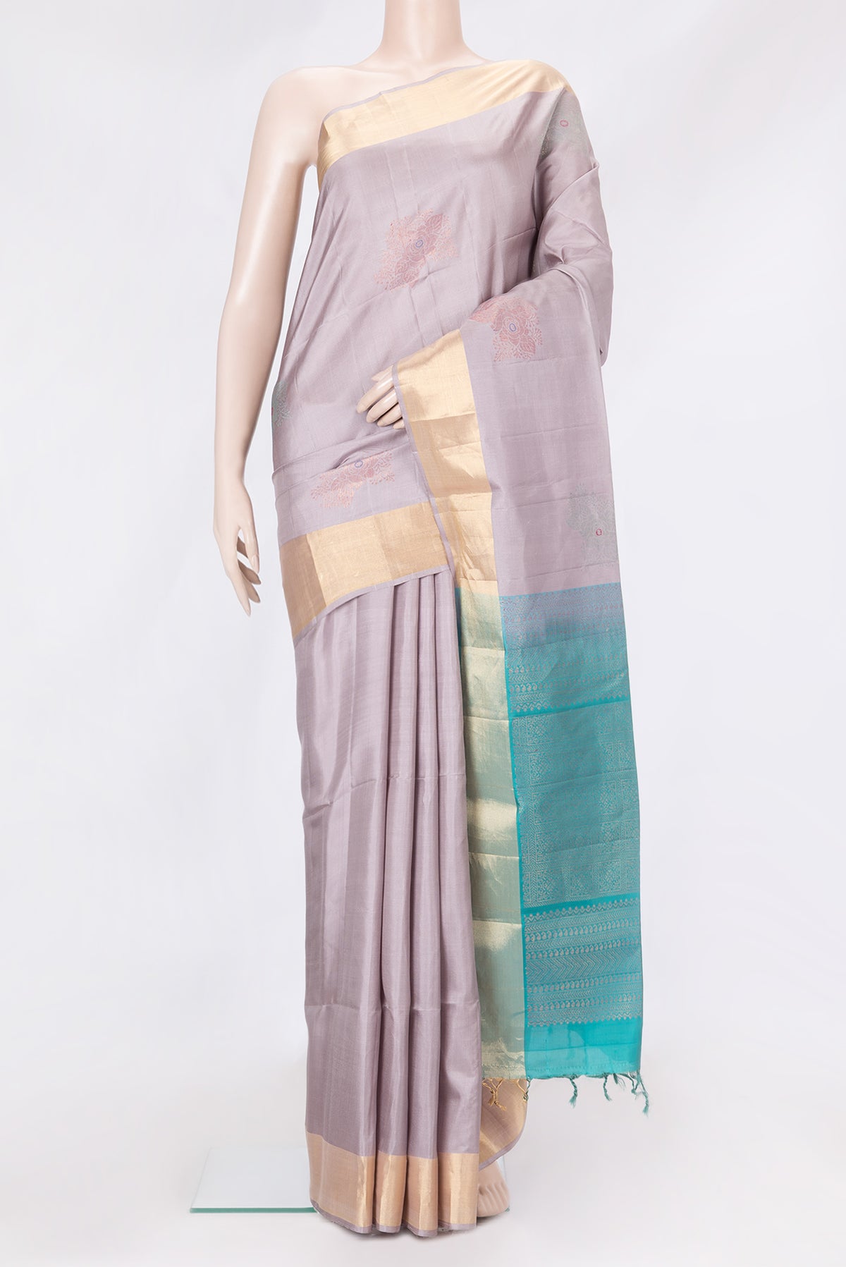 Lavender Dual Tone Soft Silk Saree with Zari Butta on the body and Zari Border.  displayed on a mannequin