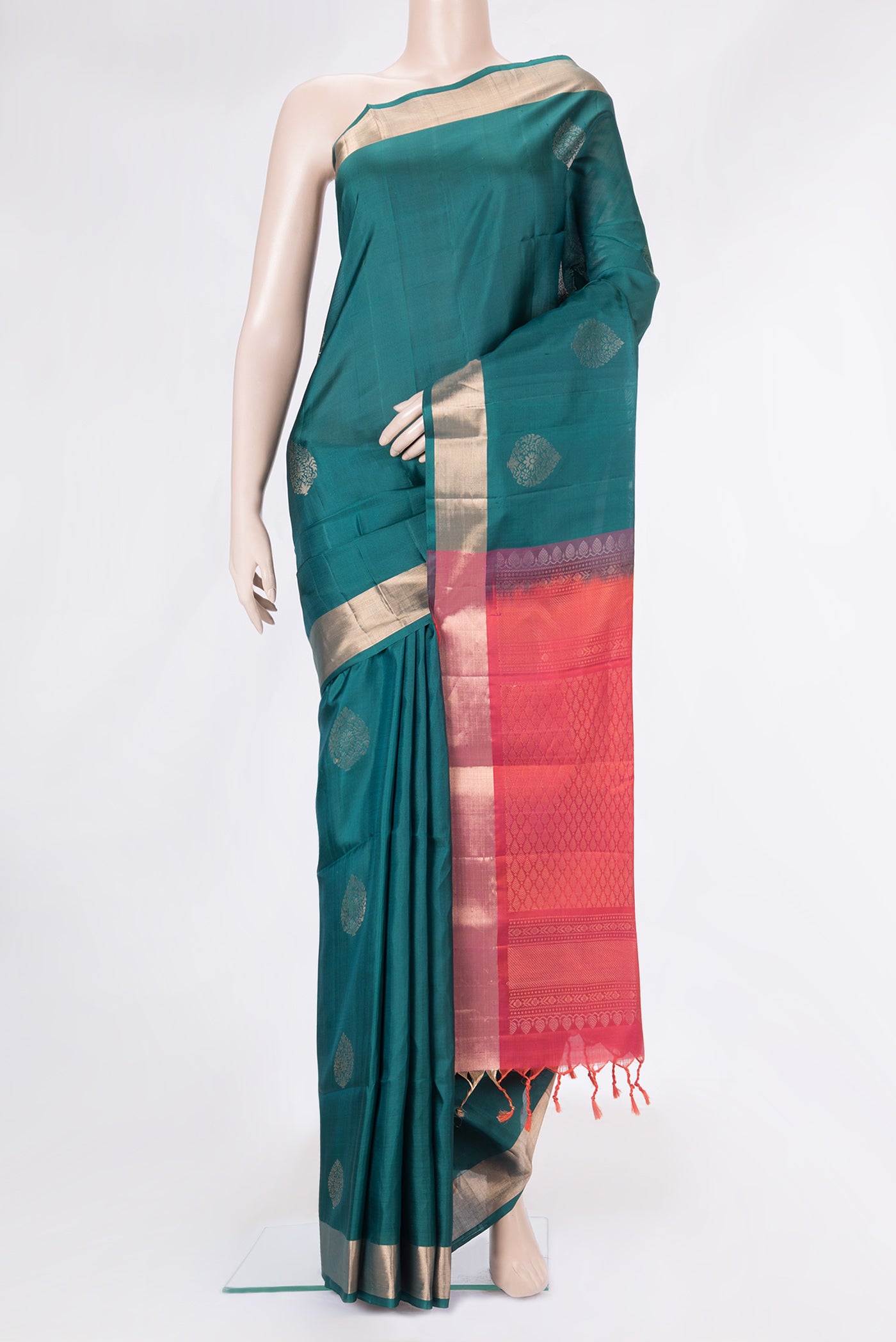 Green Dual Tone Soft Silk Saree with Zari Butta on the body and Zari Border.  displayed on a mannequin
