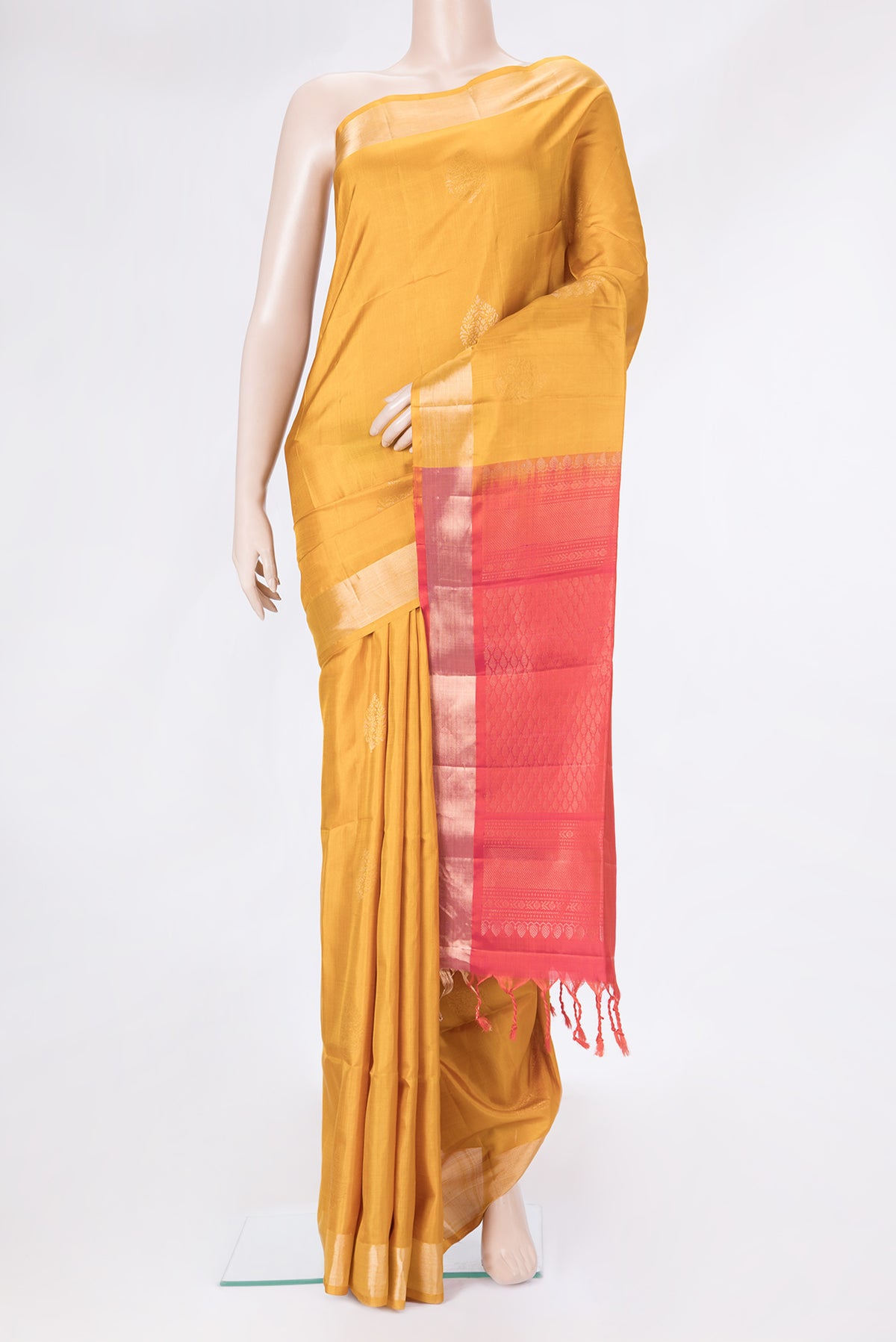 Mustard Dual Tone Soft Silk Saree with Zari Butta on the body and Zari Border.  displayed on a mannequin