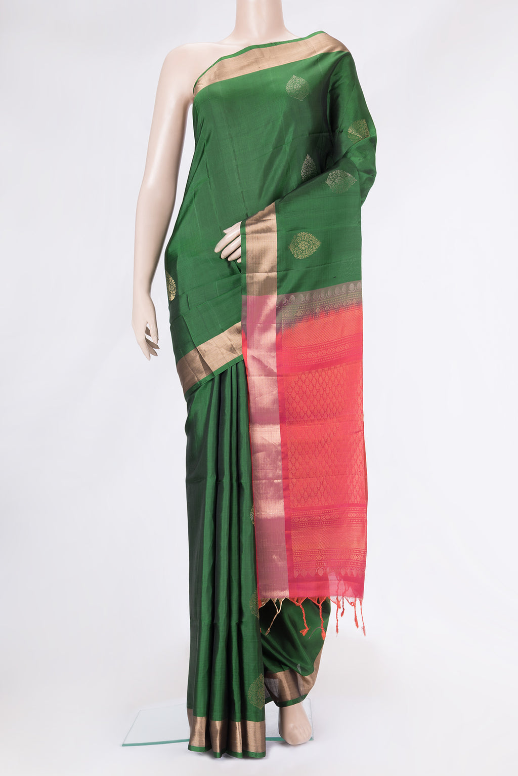 Bottle Green Dual Tone Soft Silk Saree with Zari Butta on the body and Zari Border.  displayed on a mannequin