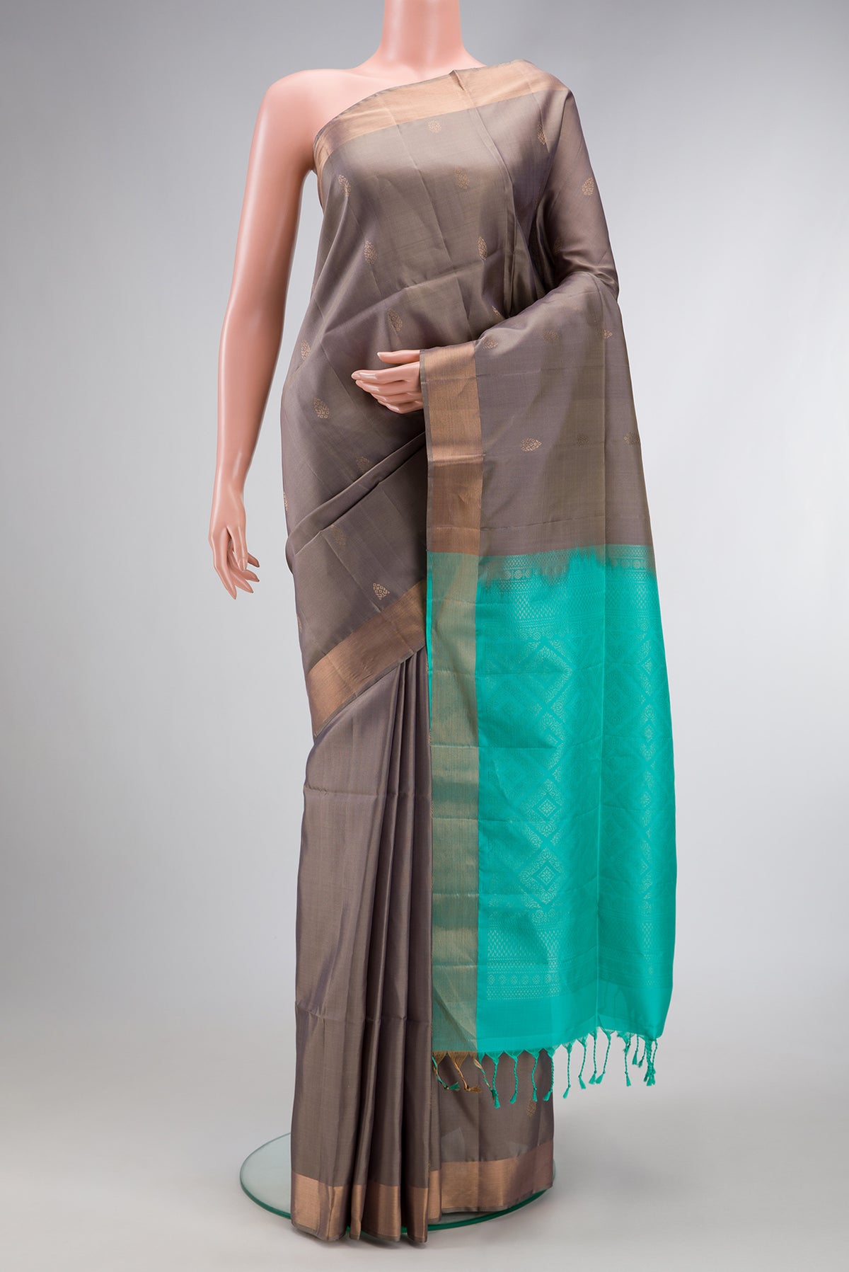 Grey Dual Tone Soft Silk Saree with Zari Butta on the body and Zari Border.  displayed on a mannequin