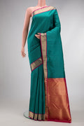 Green Dual Tone Kanchipuram Silk Saree with Stripes on the body and Zari Border.  displayed on a mannequin
