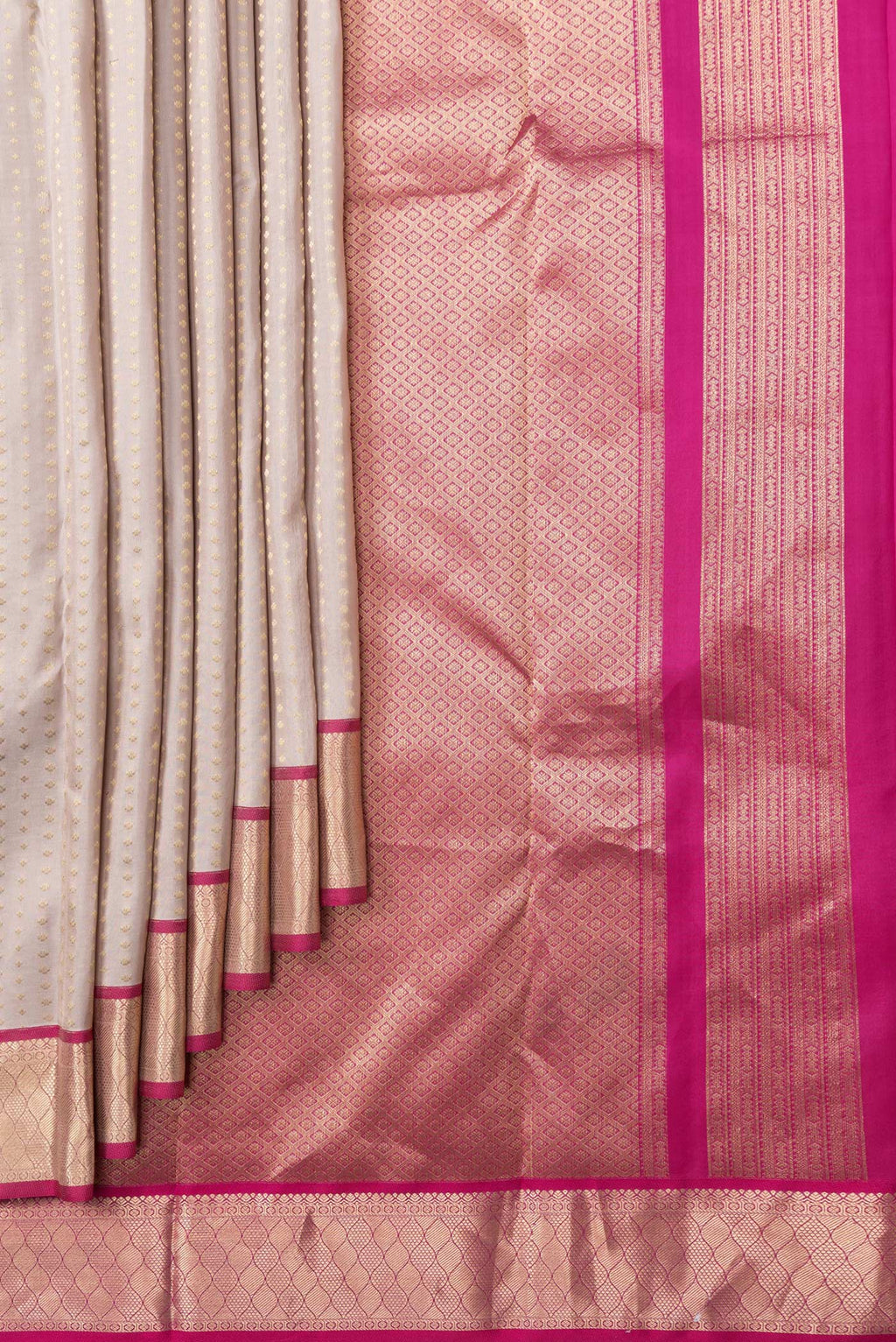 Pleats and pallu of Rose Gold Dual Tone Kanchipuram Silk Saree with Zari Butta on the body and Zari Border. 