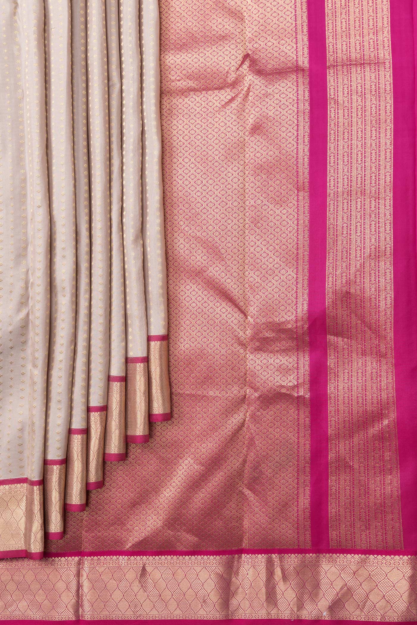 Pleats and pallu of Rose Gold Dual Tone Kanchipuram Silk Saree with Zari Butta on the body and Zari Border. 
