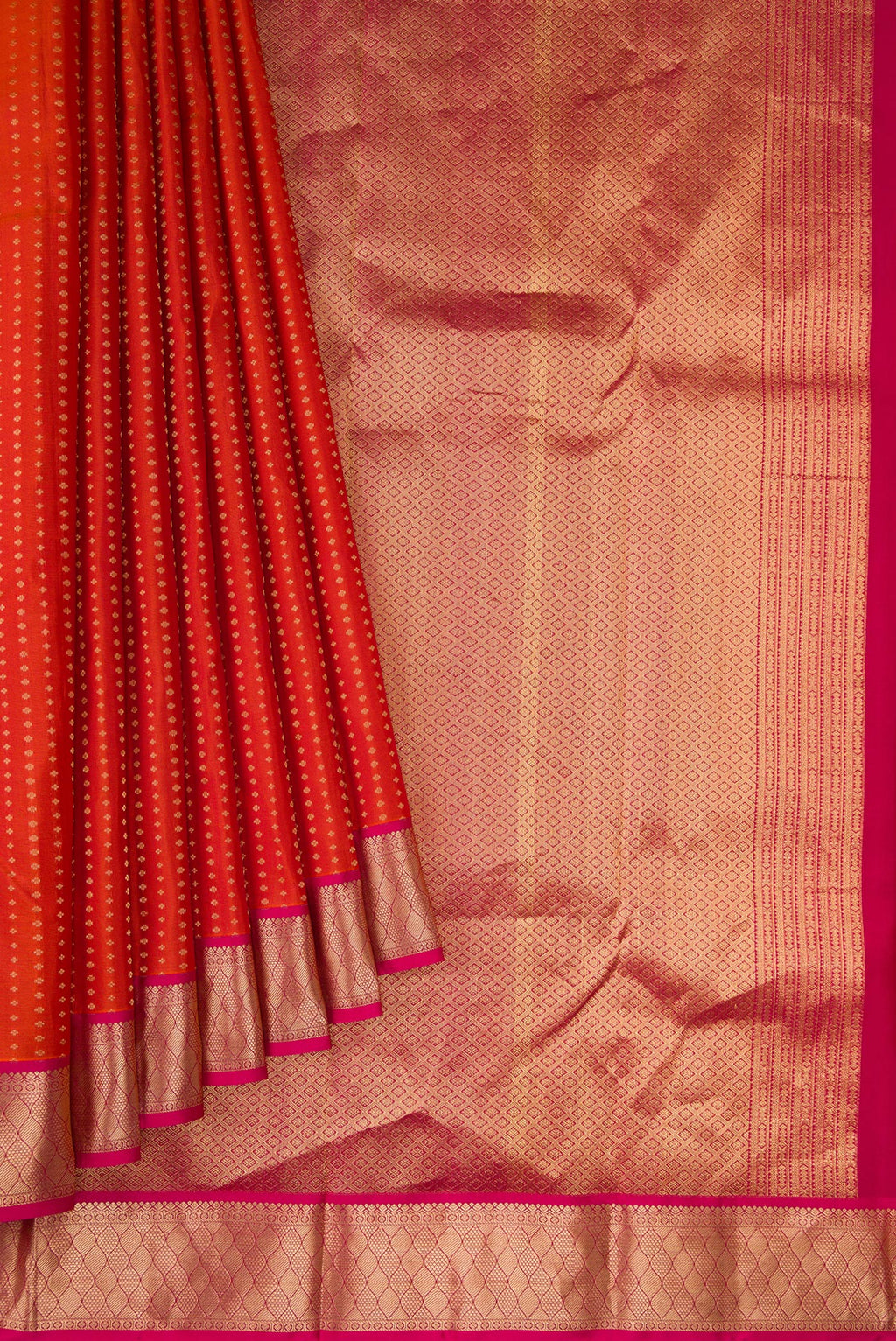 Pleats and pallu of Brick Orange Dual Tone Kanchipuram Silk Saree with Stripes on the body and Zari Border. 