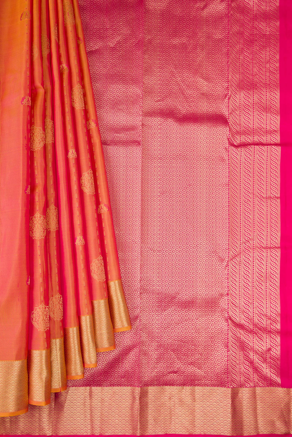 Pleats and pallu of Coral Dual Tone Kanchipuram Silk Saree with Zari Butta on the body and Zari Border. 