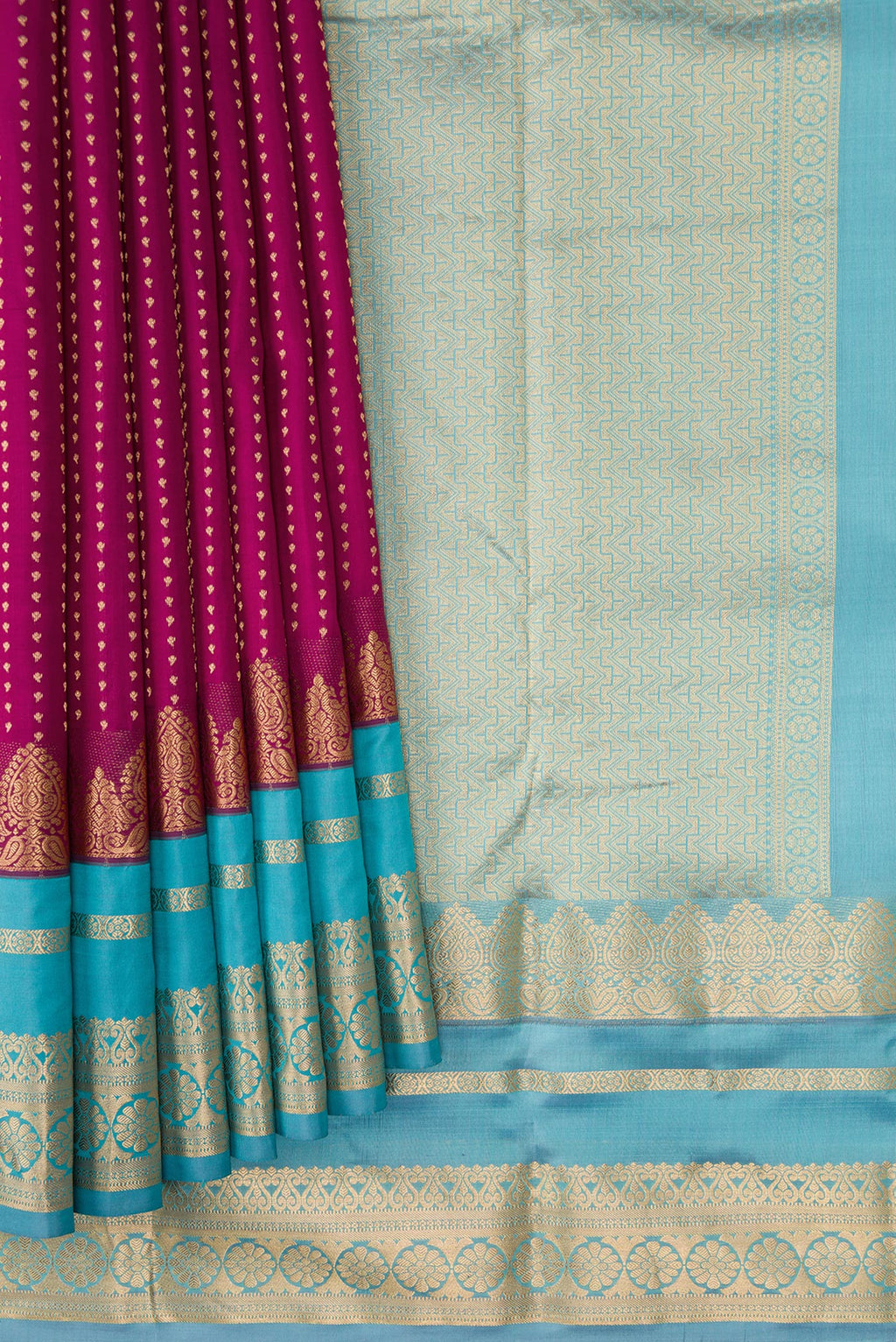 Pleats and pallu of Maroon Dual Tone Kanchipuram Silk Saree with Stripes on the body and Fancy Border. 