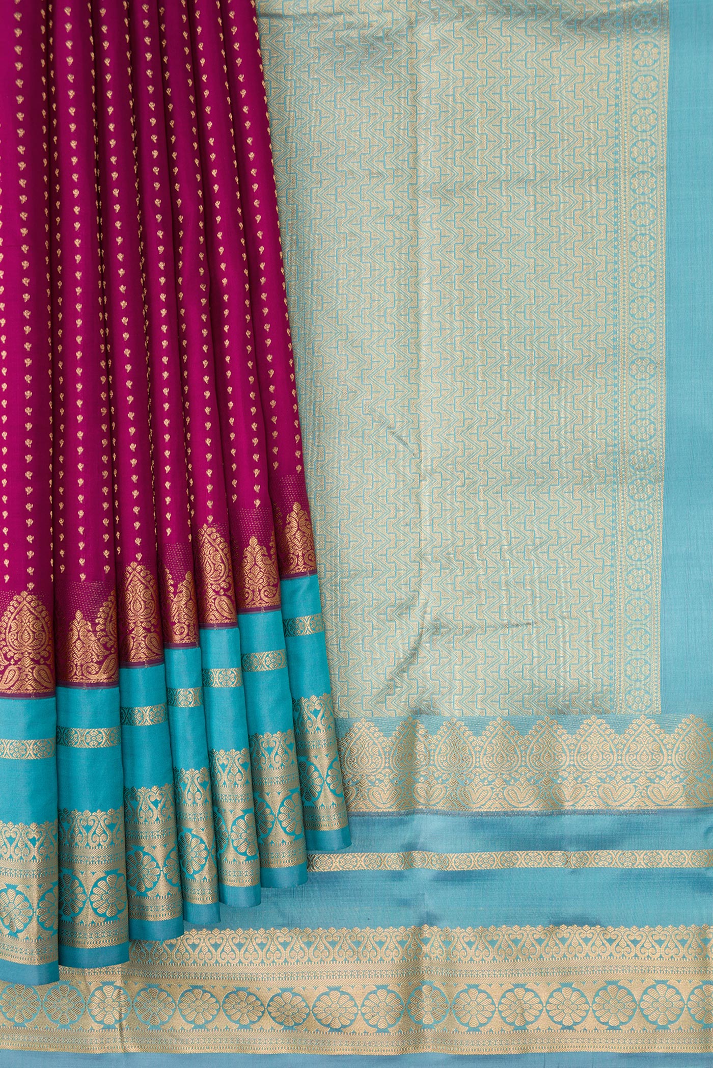 Pleats and pallu of Maroon Dual Tone Kanchipuram Silk Saree with Stripes on the body and Fancy Border. 