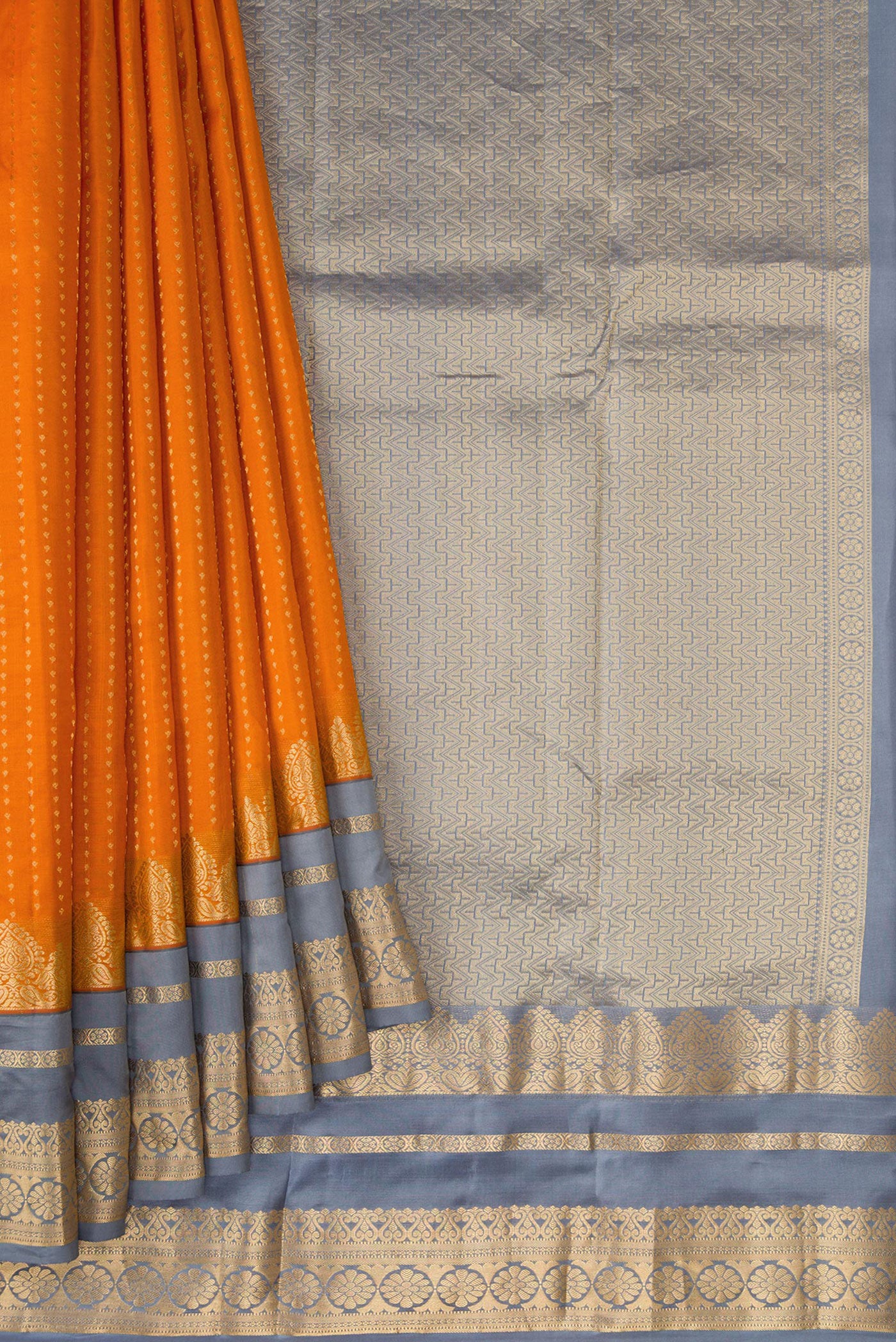 Pleats and pallu of Orange Dual Tone Kanchipuram Silk Saree with Stripes on the body and Fancy Border. 