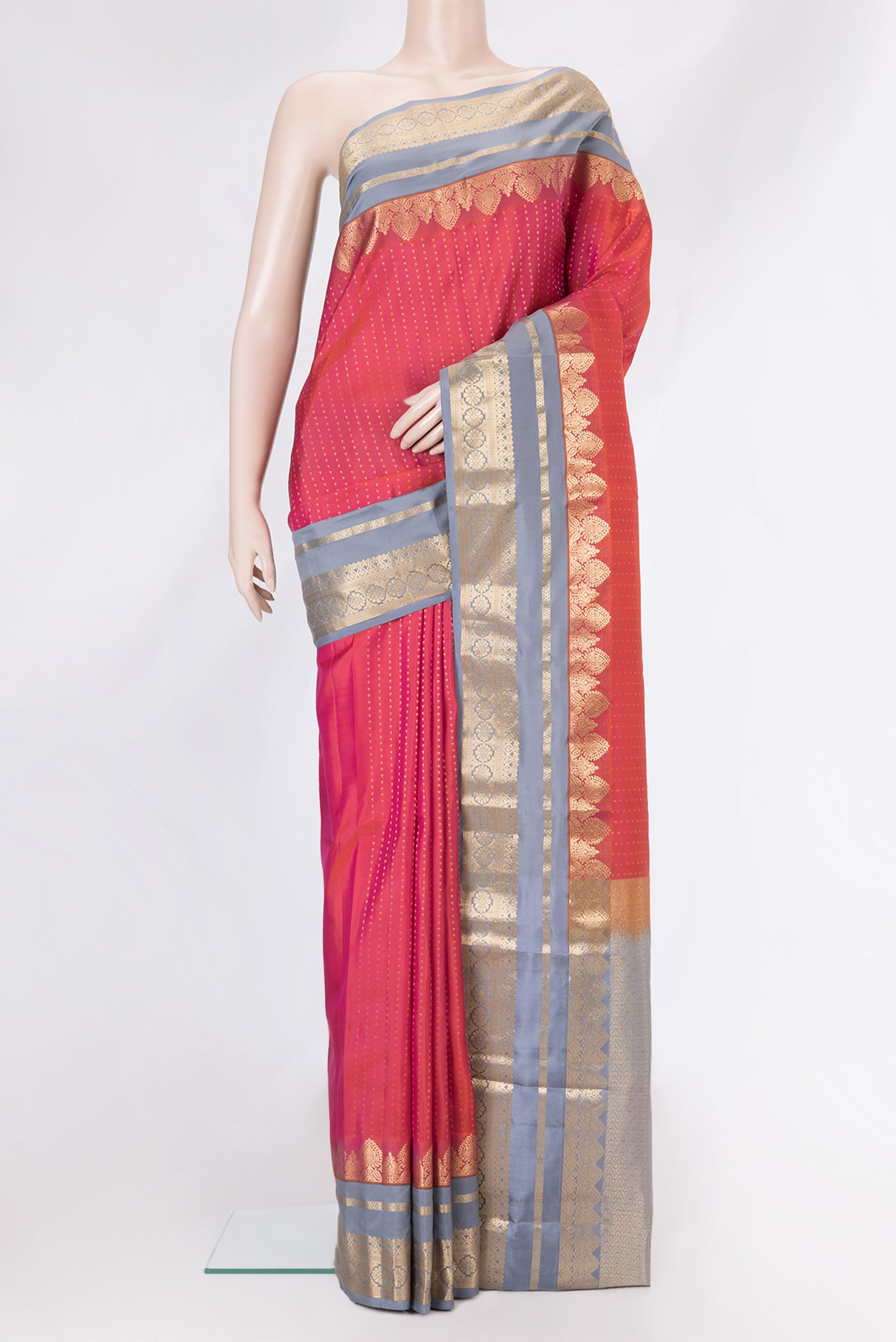 Pink Dual Tone Kanchipuram Silk Saree with Zari Butta on the body and Zari Border.  displayed on a mannequin