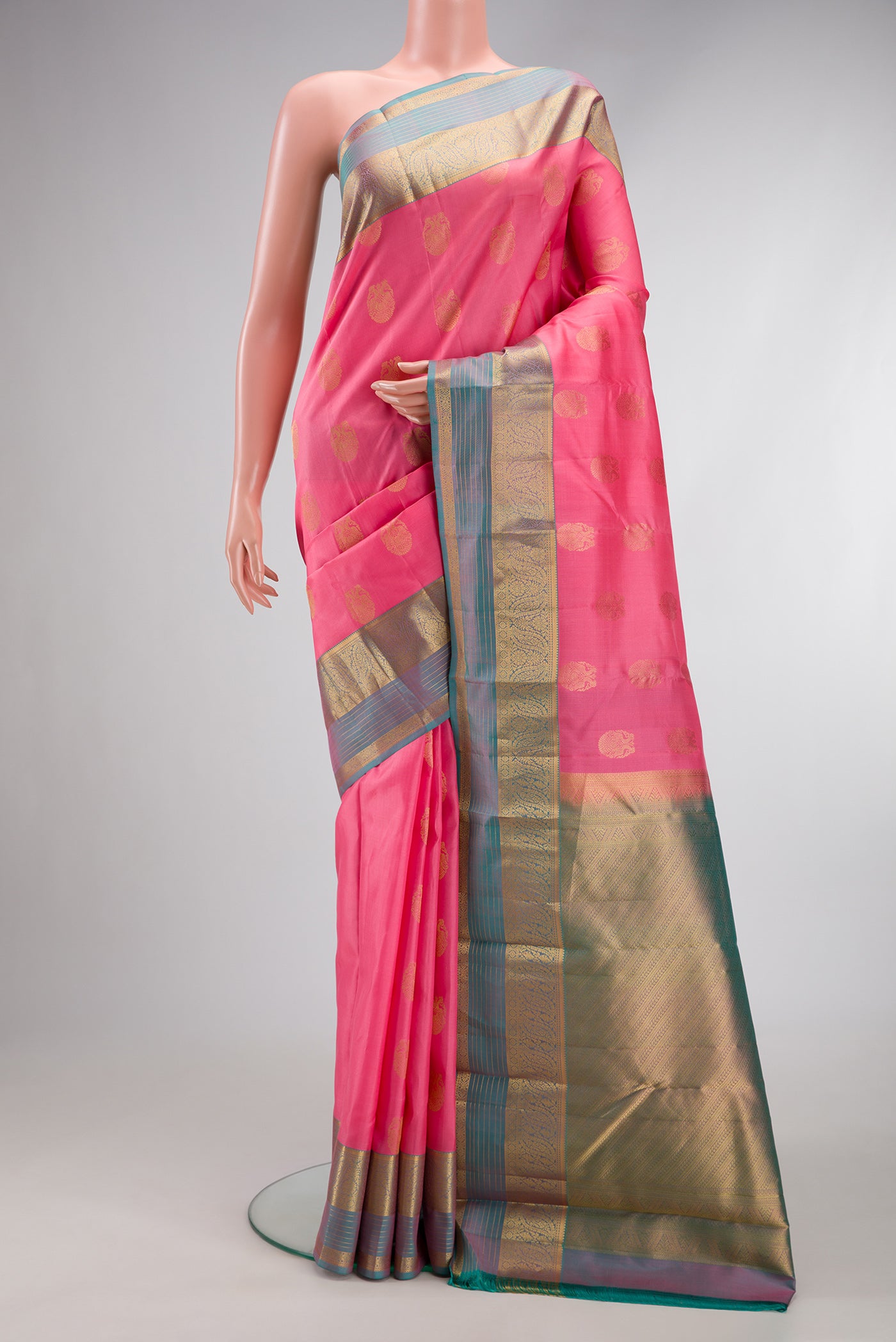 Pink Dual Tone Kanjivaram Silk Saree with Zari Butta on the body and Zari Border.  displayed on a mannequin