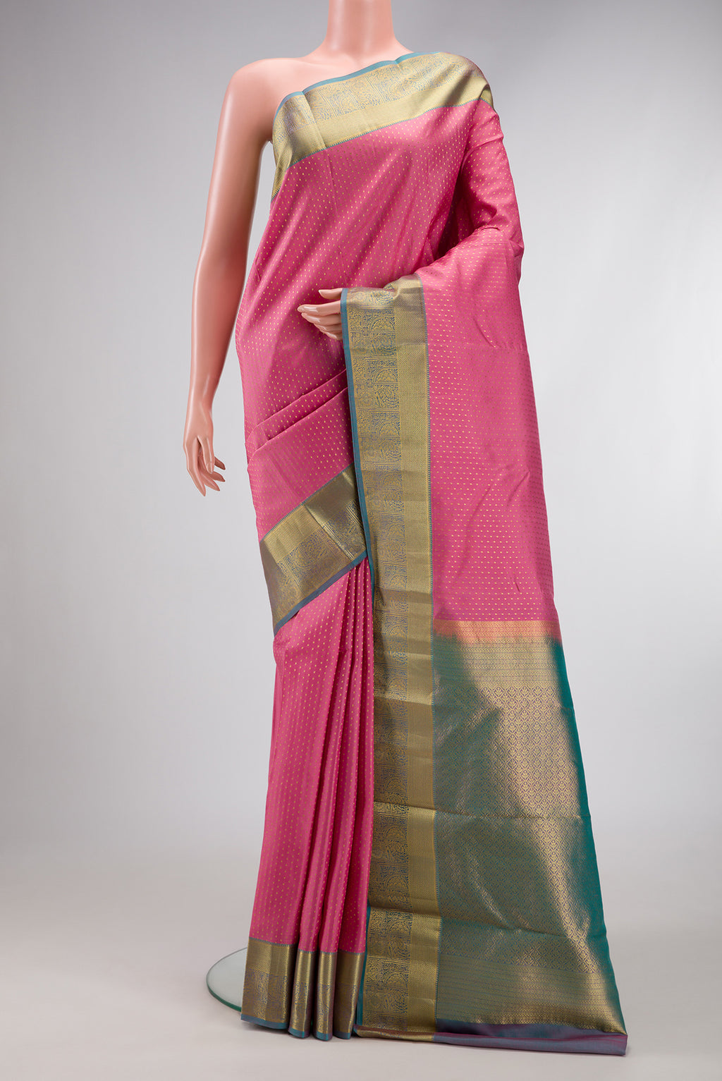 Pink Dual Tone Kanchipuram Silk Saree with Zari Butta on the body and Zari Border.  displayed on a mannequin
