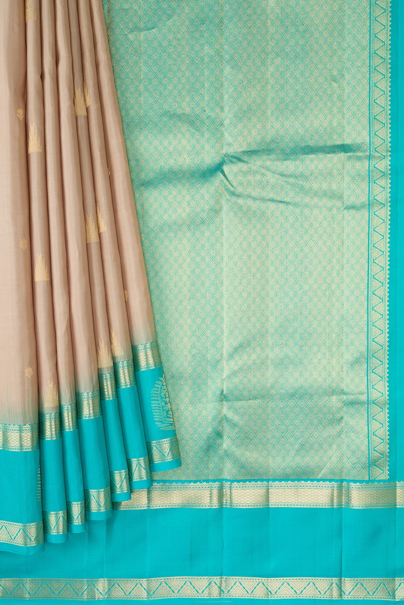Pleats and pallu of Beige Dual Tone Kanjivaram Silk Saree with Zari Butta on the body and Fancy Border. 