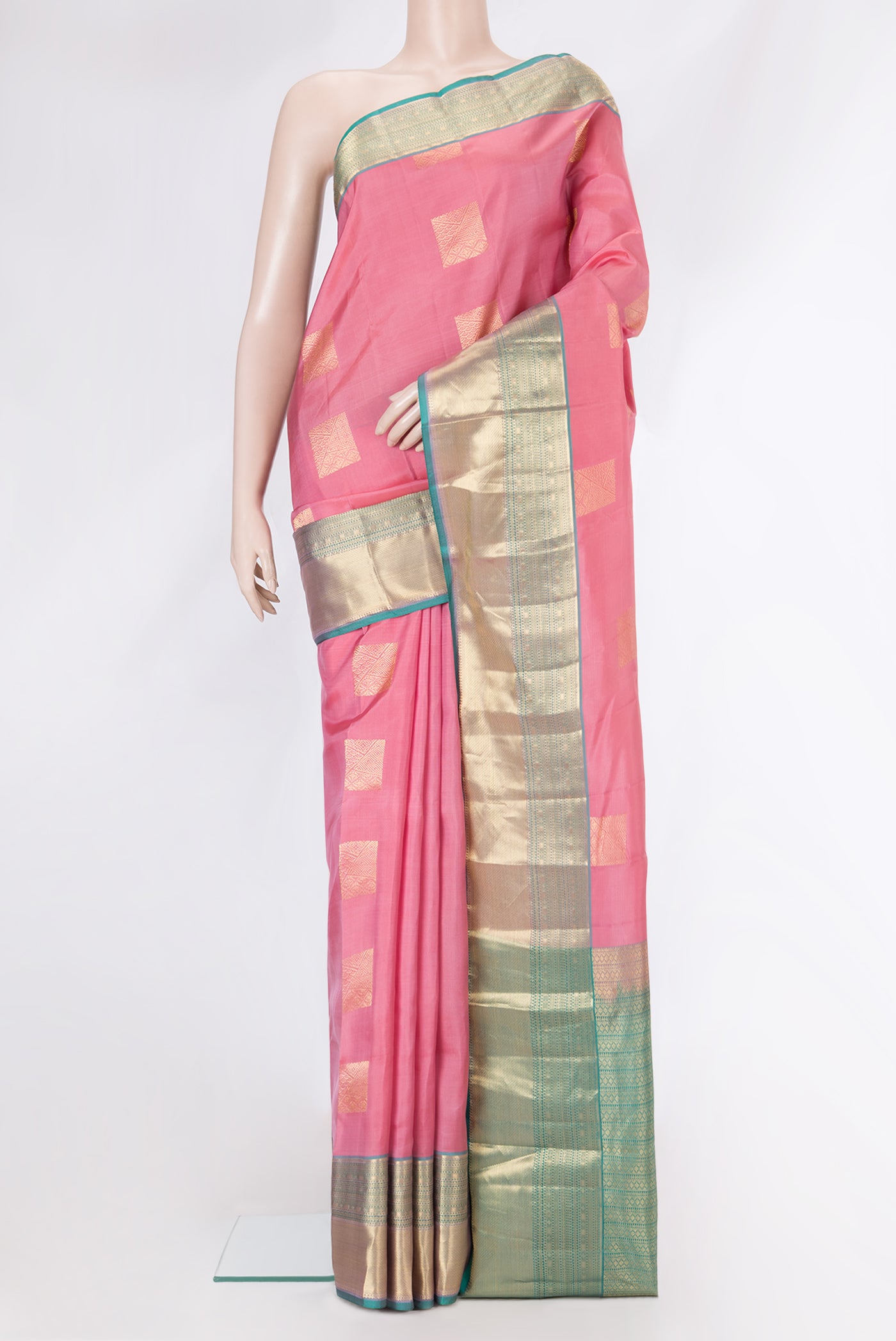 Pink Kanchipuram Silk Saree with Zari Butta on the body and Zari Border.  displayed on a mannequin