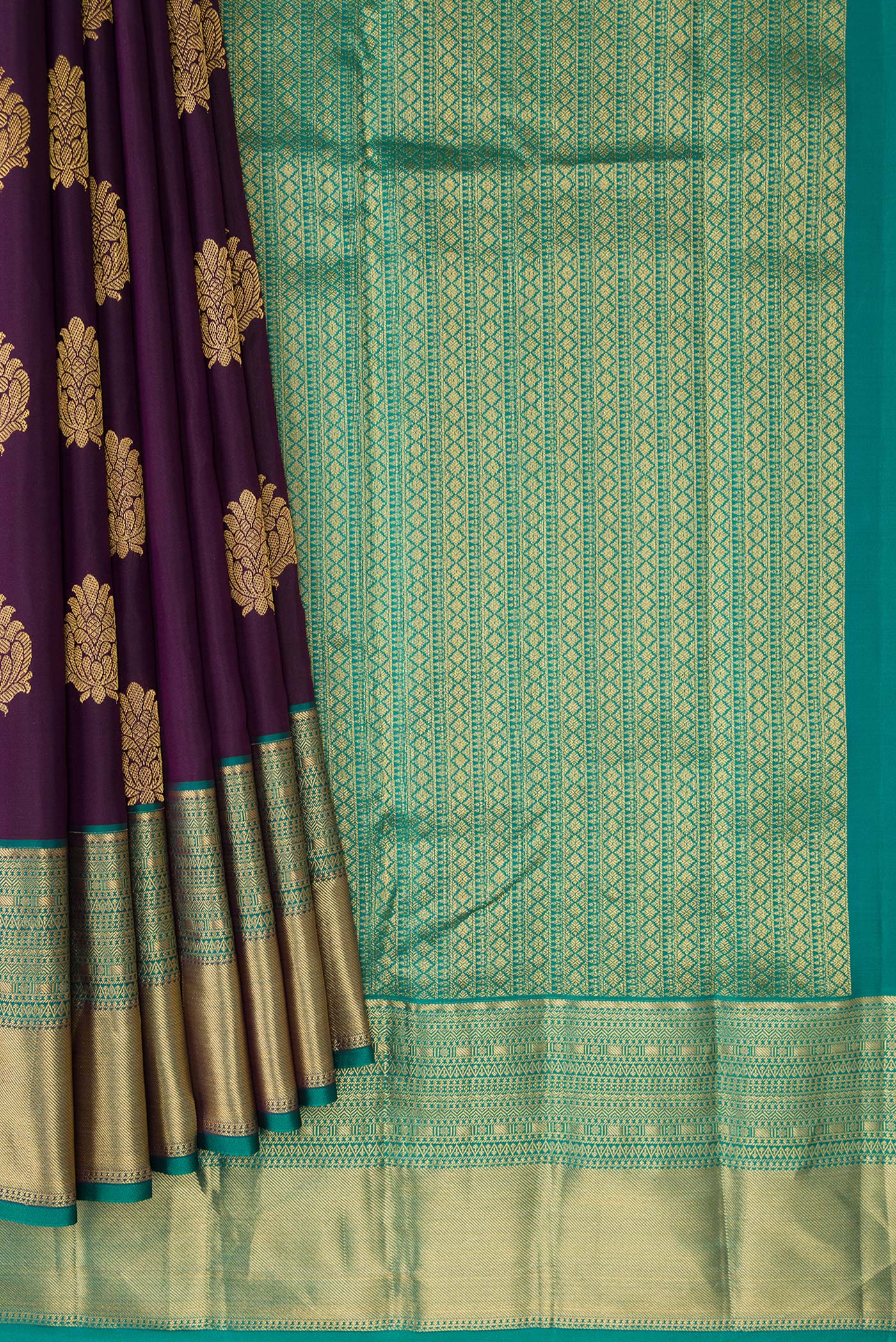 Pleats and pallu of Burgundy Dual Tone Kanchipuram Silk Saree with Zari Butta on the body and Zari Border. 