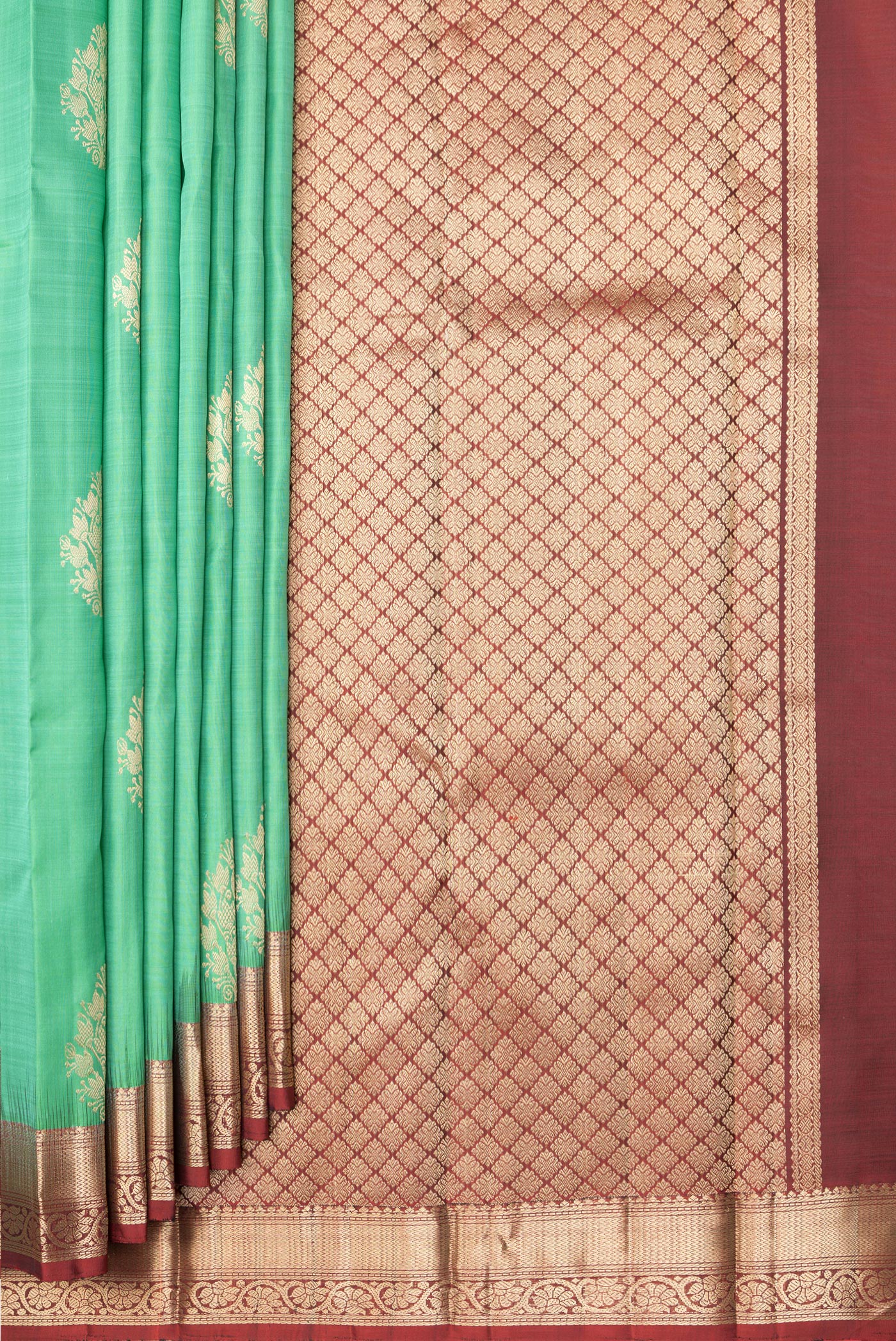 Pleats and pallu of Pista Green Dual Tone Kanjivaram Silk Saree with Zari Butta on the body and Zari Border. 