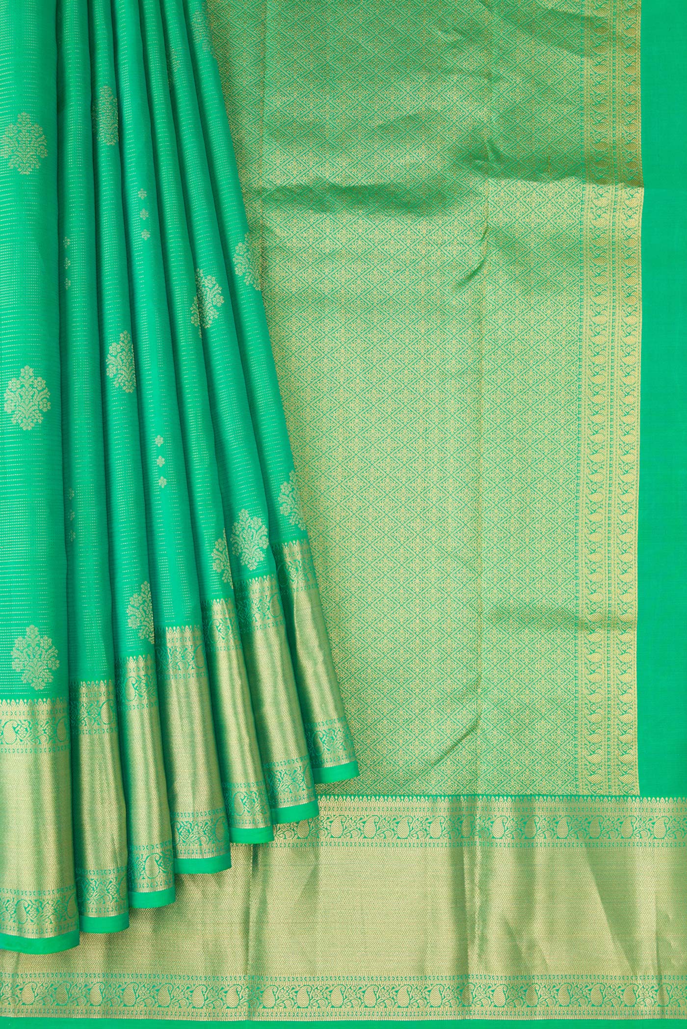 Pleats and pallu of Green Dual Tone Kanjivaram Silk Saree with Zari Butta on the body and Zari Border. 