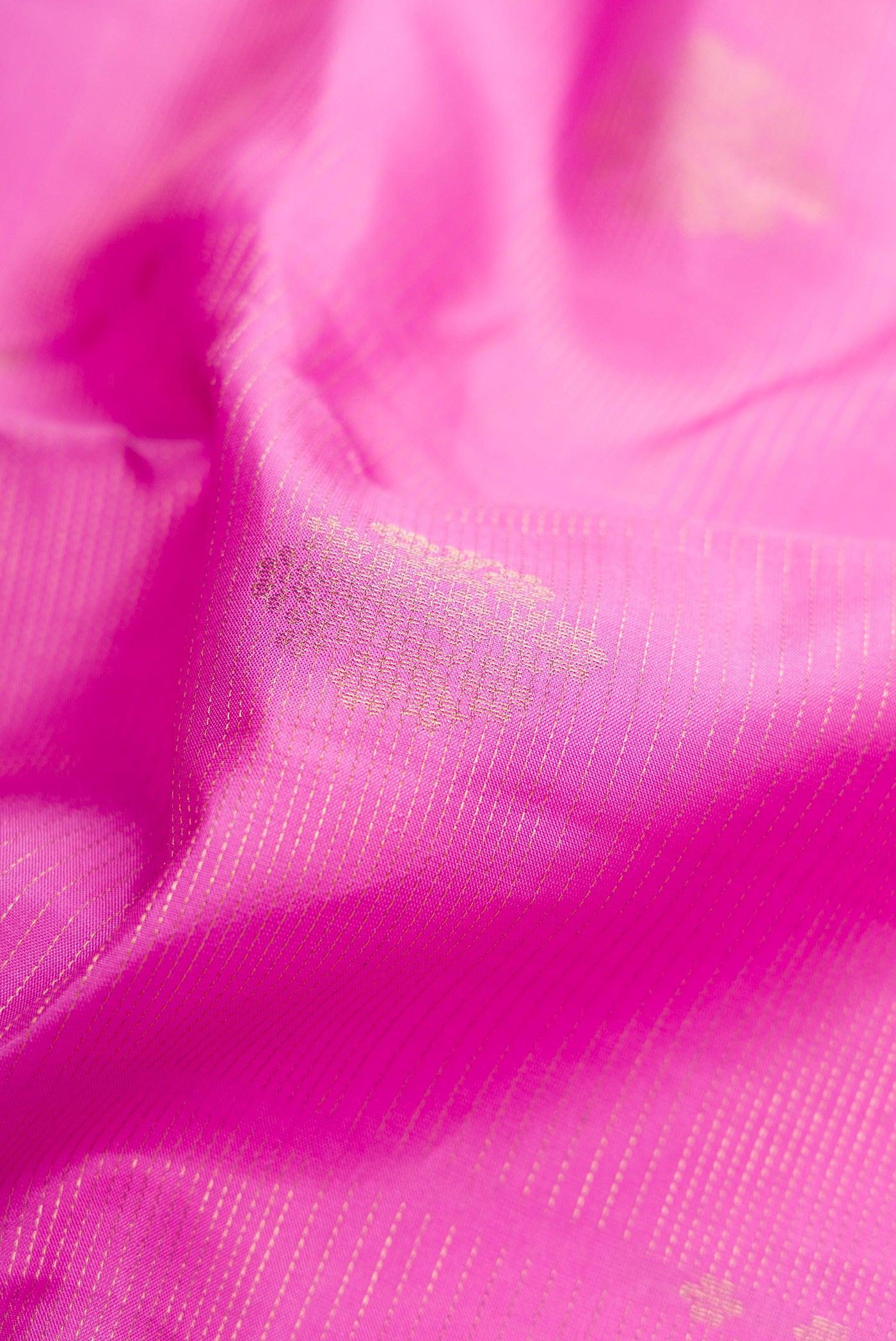 Close up of Lavender Dual Tone Kanjivaram Silk Saree with Zari Butta on the body and Zari Border.  displaying folds