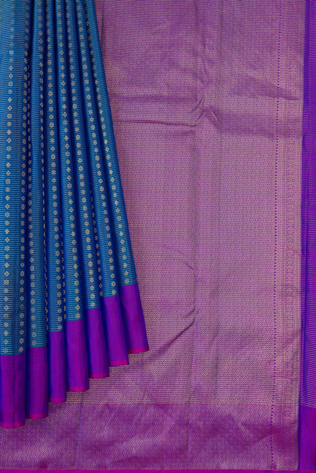 Pleats and pallu of Peacock Blue Dual Tone Kanchipuram Silk Saree with Stripes on the body and Plain Border. 