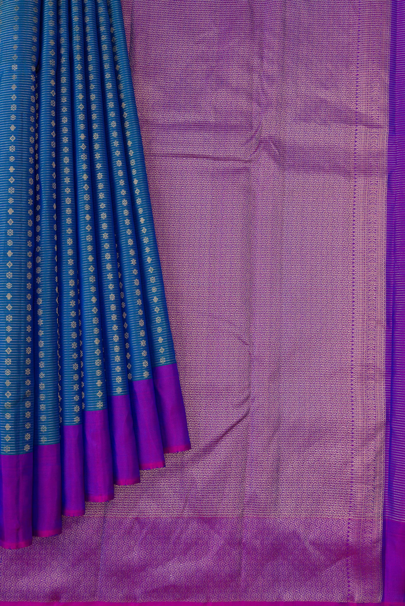 Pleats and pallu of Peacock Blue Dual Tone Kanchipuram Silk Saree with Stripes on the body and Plain Border. 