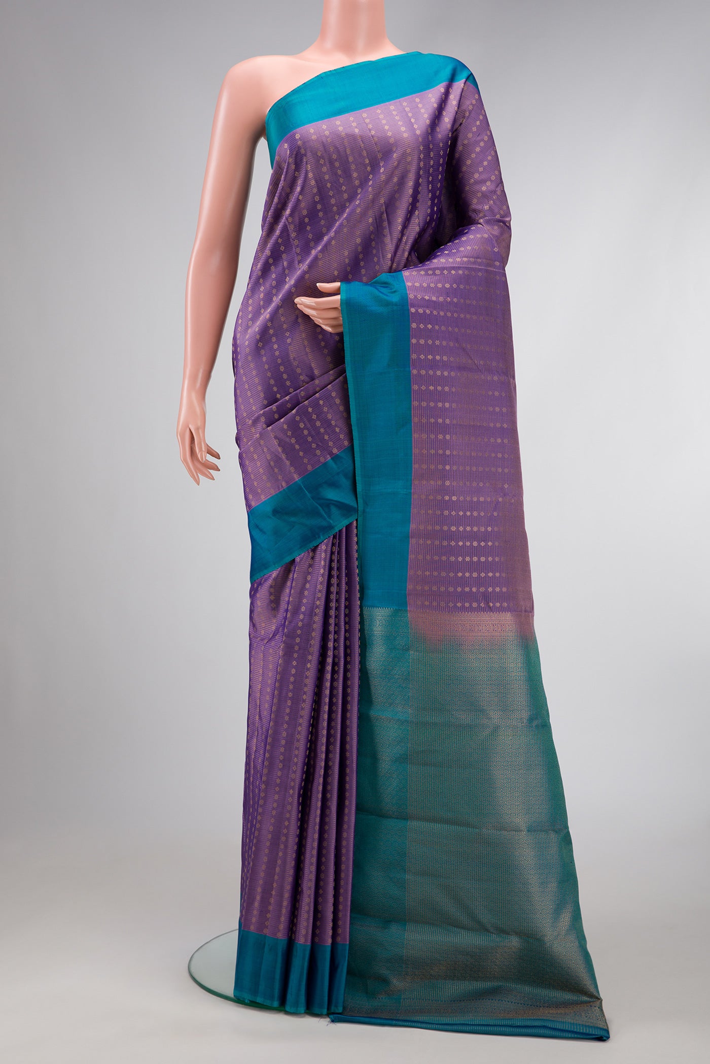 Purple Dual Tone Kanchipuram Silk Saree with Stripes on the body and Plain Border.  displayed on a mannequin