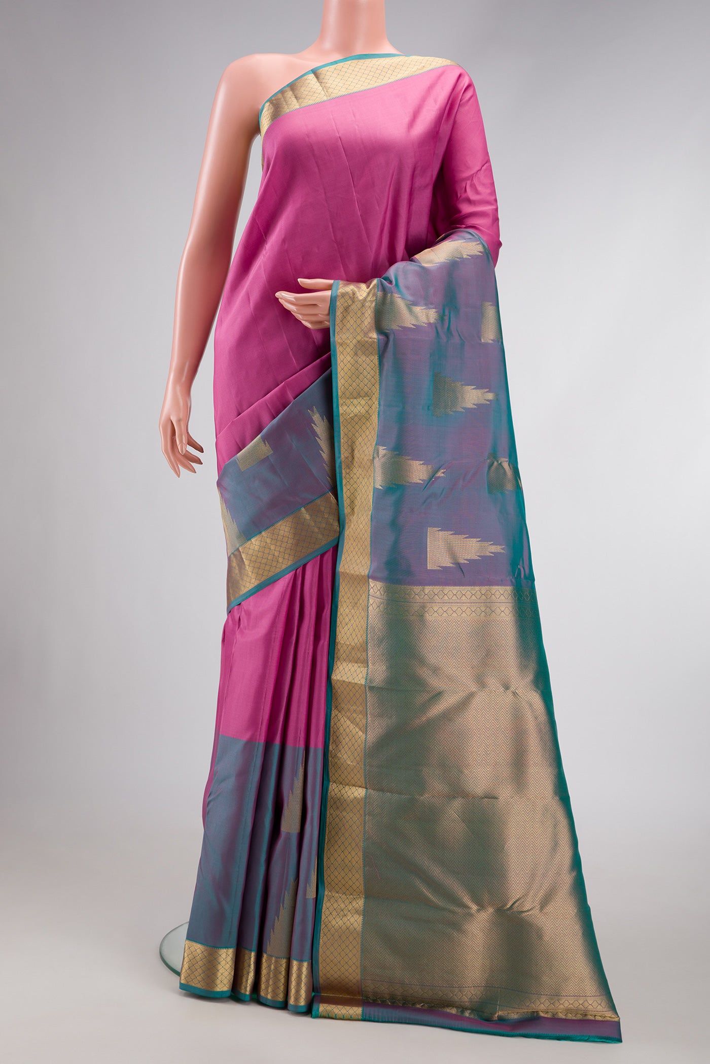 Pink Dual Tone Kanchipuram Silk Saree with Plain Body and Fancy Border.  displayed on a mannequin