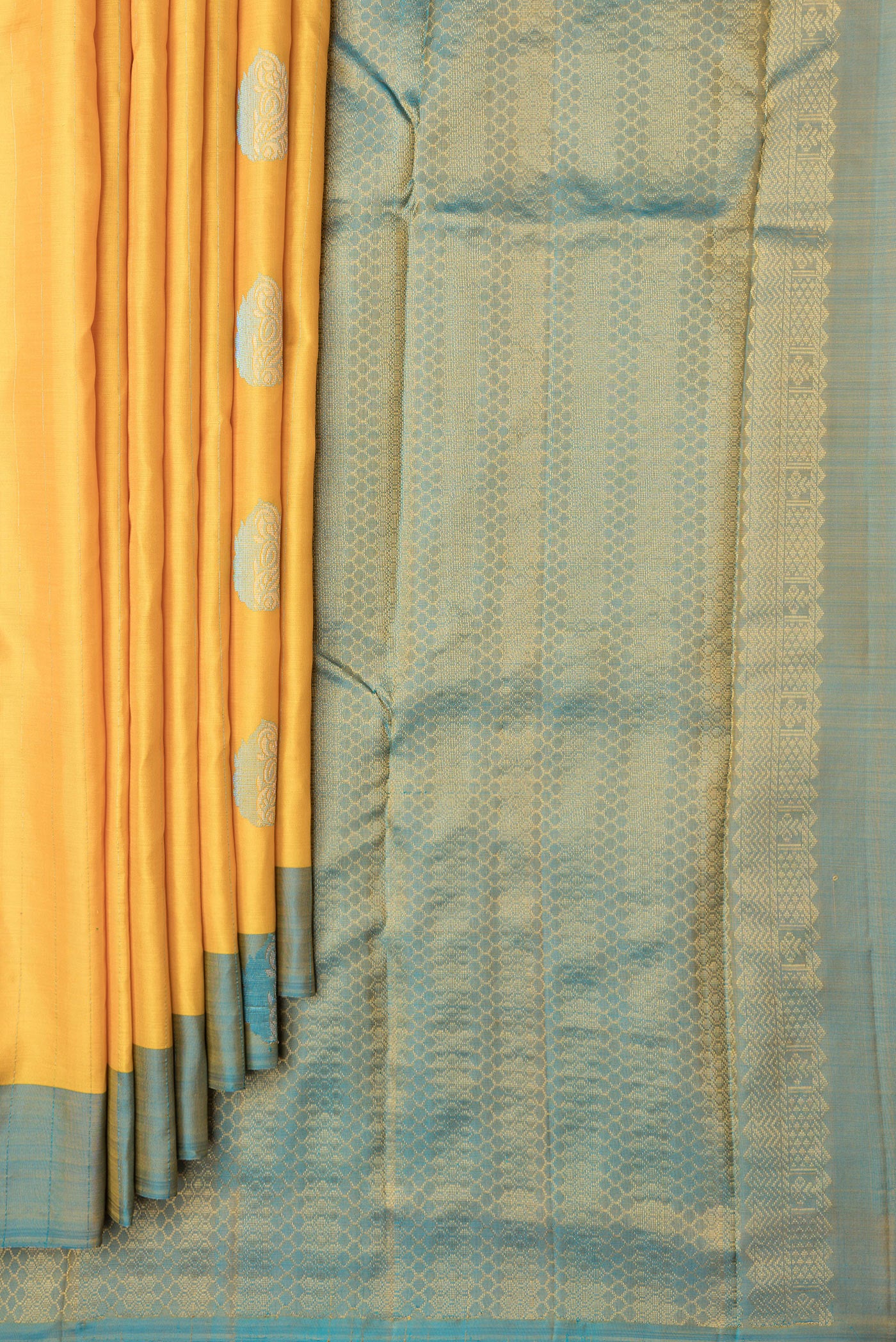 Pleats and pallu of Yellow Dual Tone Kanchipuram Silk Saree with Stripes on the body and Fancy Border. 