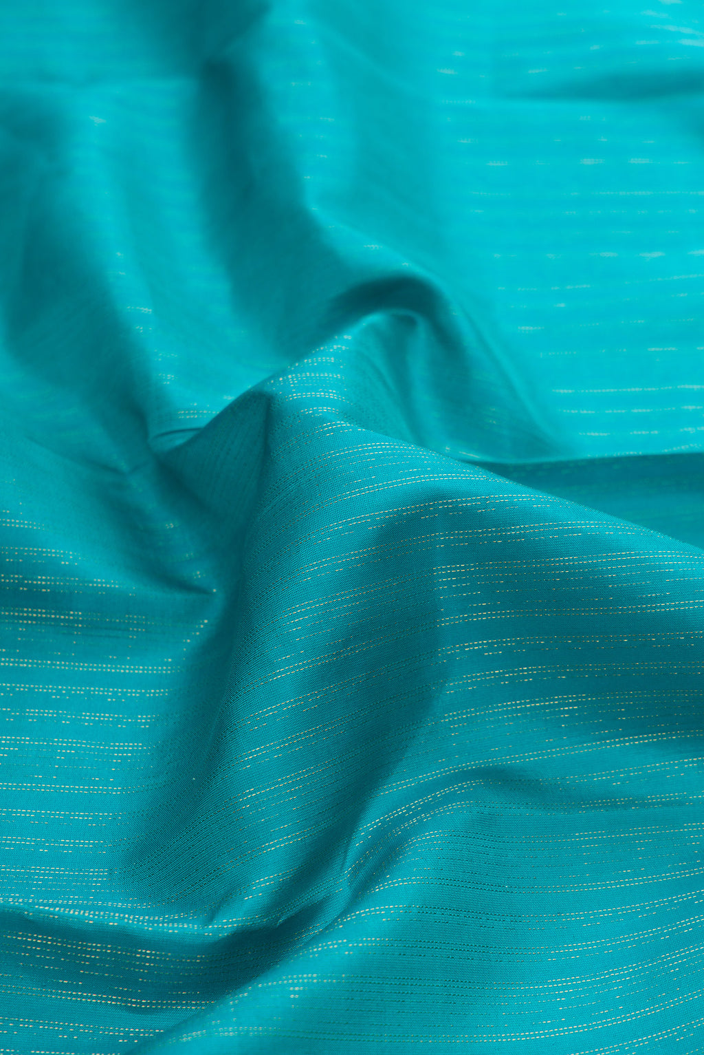 Close up of Sky Blue Dual Tone Kanchipuram Silk Saree with Stripes on the body and Zari And Thread Border.  displaying folds