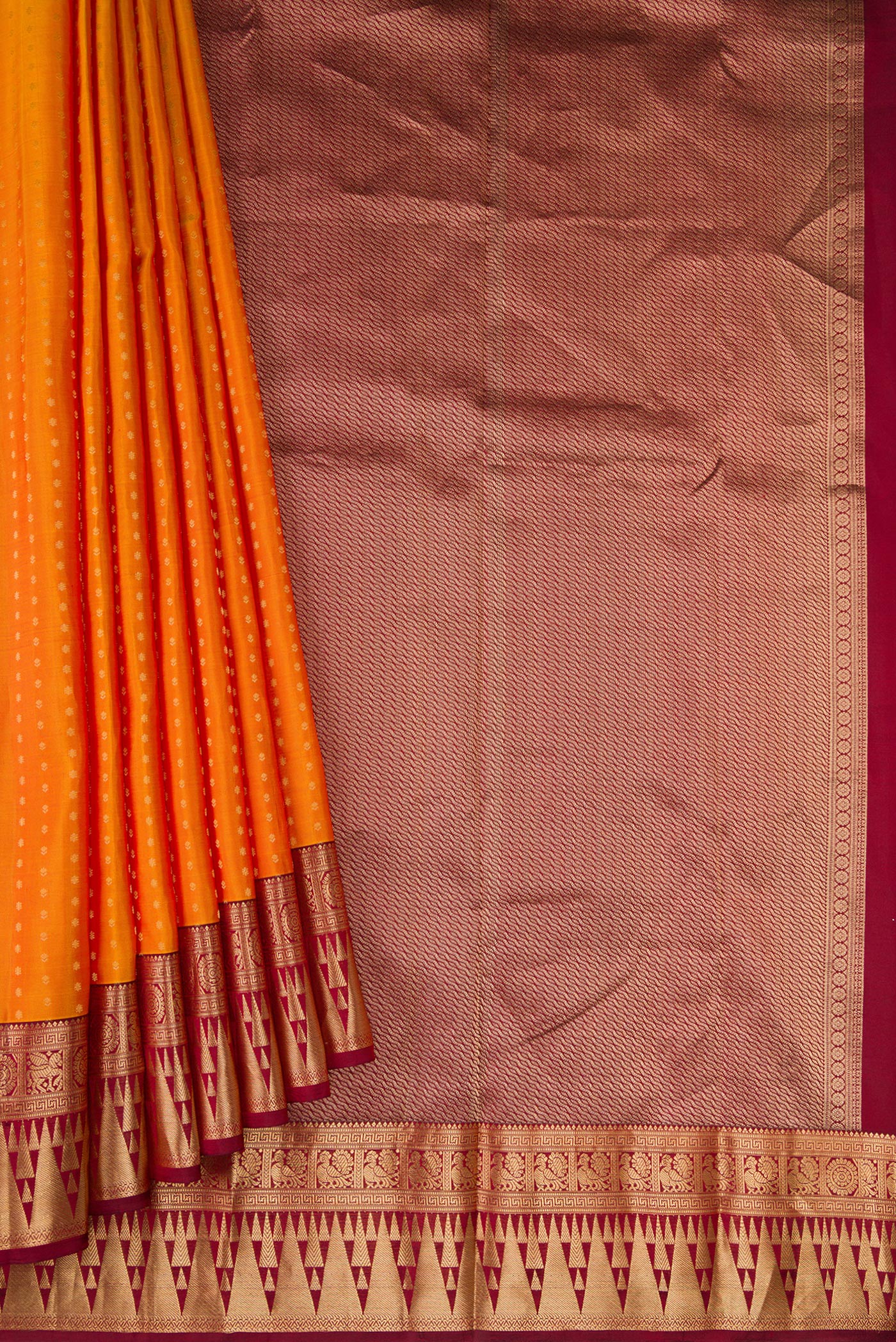 Pleats and pallu of Mustard Dual Tone Kanchipuram Silk Saree with Zari Butta on the body and Fancy Border. 