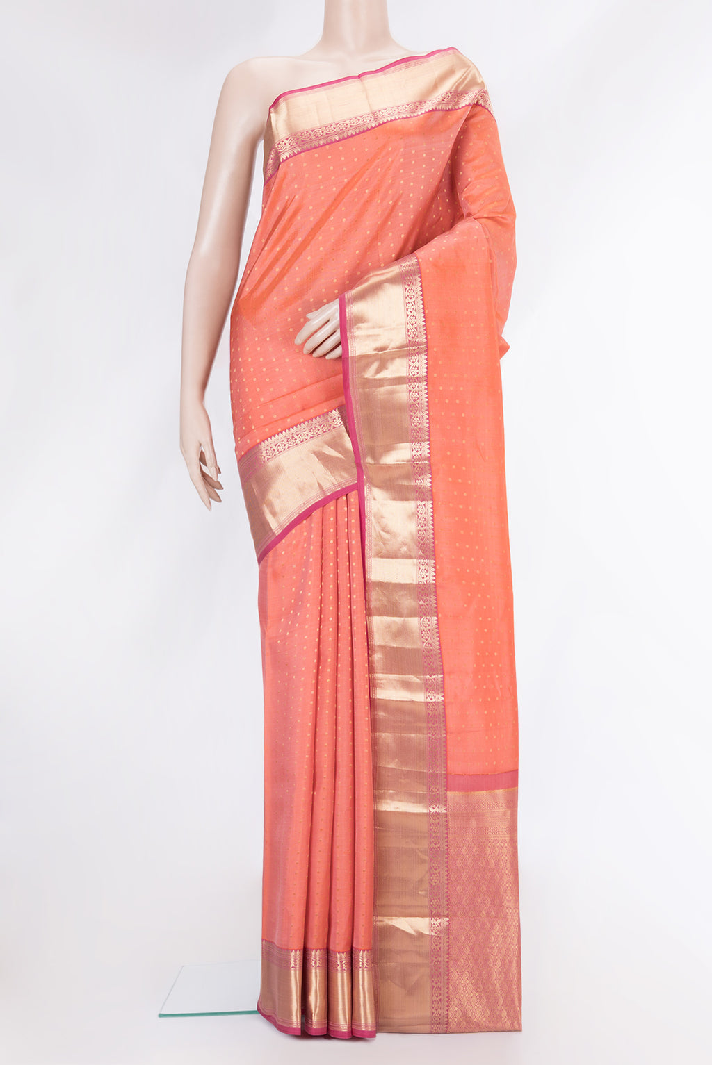 Peach Dual Tone Kanchipuram Silk Saree with Zari Butta on the body and Zari Border.  displayed on a mannequin
