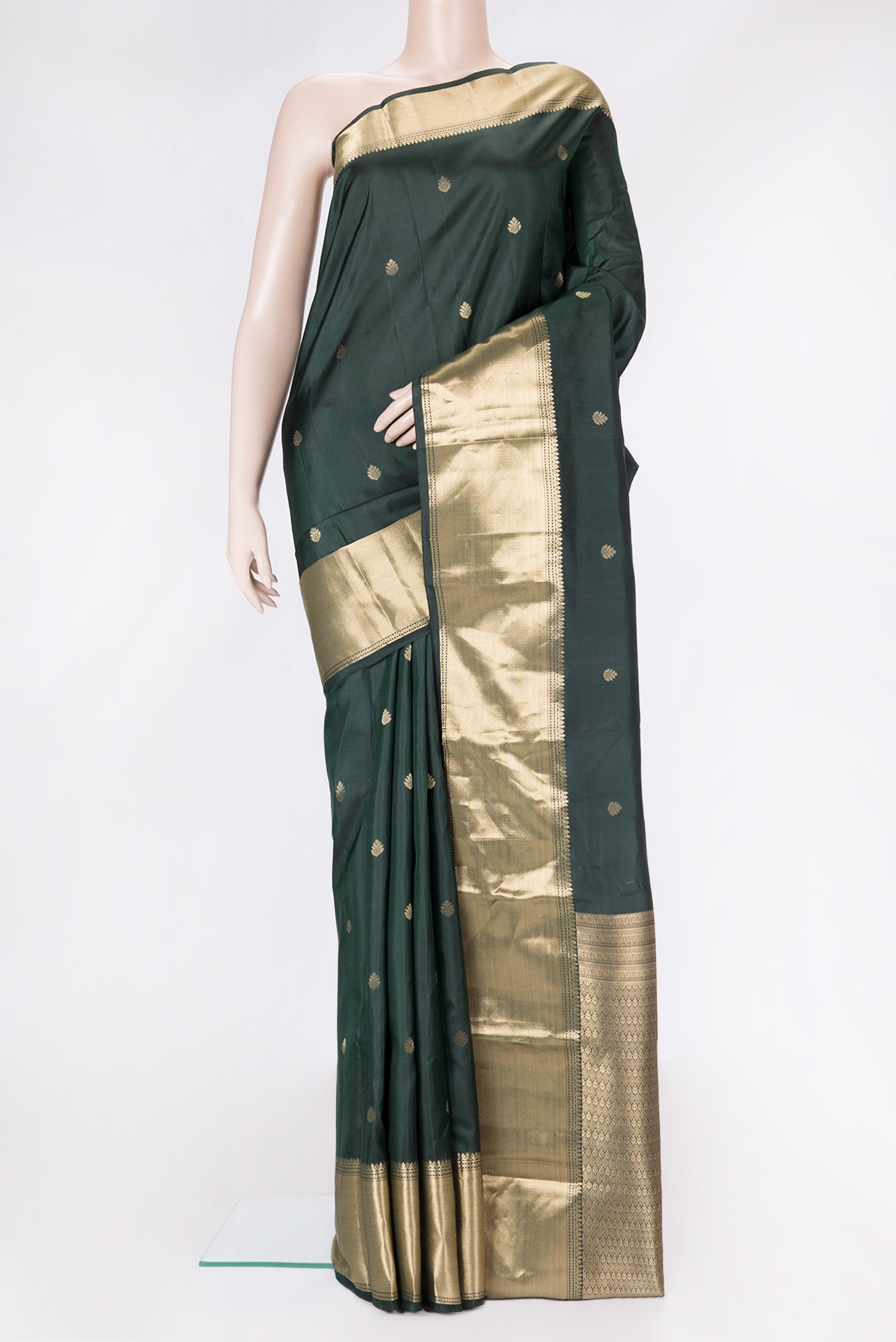 Bottle Green Dual Tone Kanchipuram Silk Saree with Zari Butta on the body and Zari Border.  displayed on a mannequin
